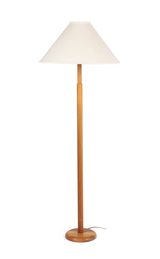 MCM FLOOR LAMP: MCM FLOOR LAMPLikely by Jane and Gordon Martz for Marshall studio, unsigned, 20th century. Straight wooden standard recessed near the top, on circular base, with tapering shade.Height: 59 in. (149.9 c