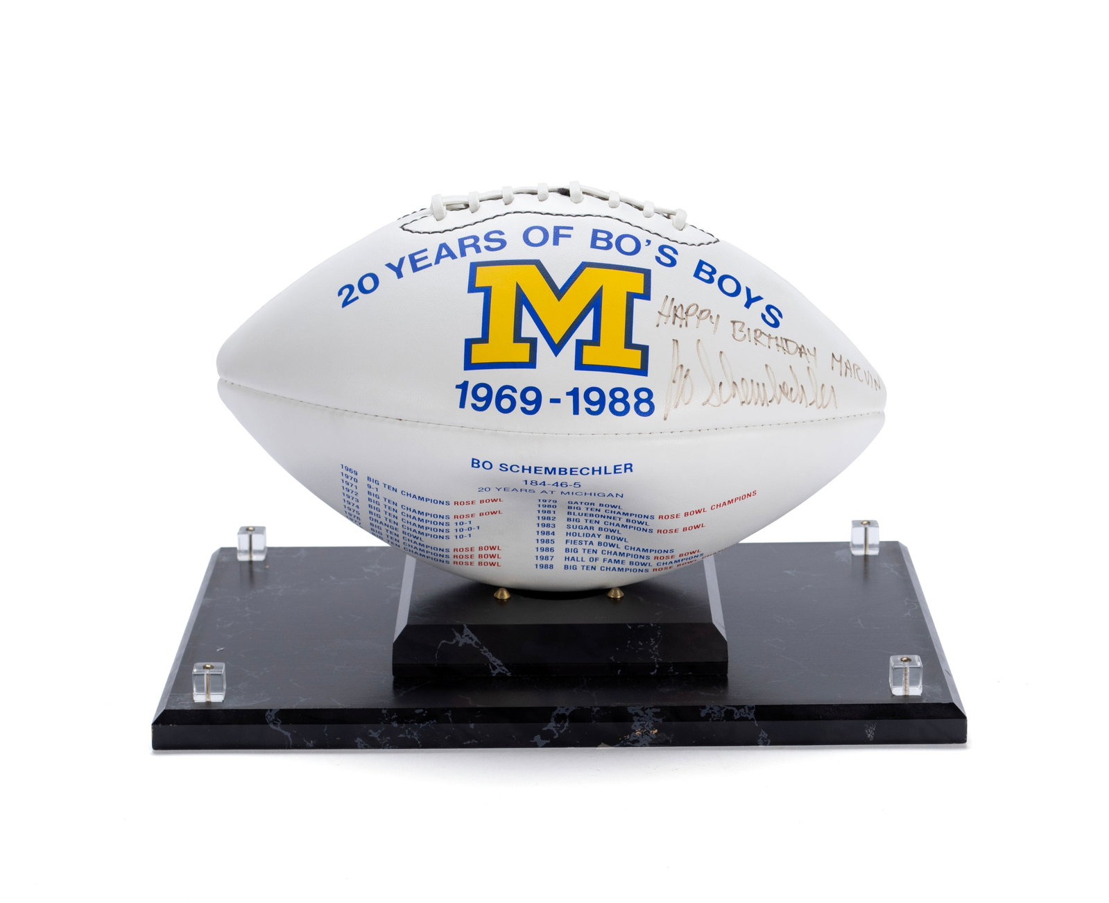 BO SCHEMBECHLER AUTOGRAPHED MICHIGAN FOOTBALL: BO SCHEMBECHLER AUTOGRAPHED MICHIGAN FOOTBALL Commemorative Michigan football celebrating '20 Years of Bo's Boys.' Signed Happy Birthday Marvin-Bo Schembechler. Case: 9 x 13 x 9 in. (22.9 x 33 x 22.9 