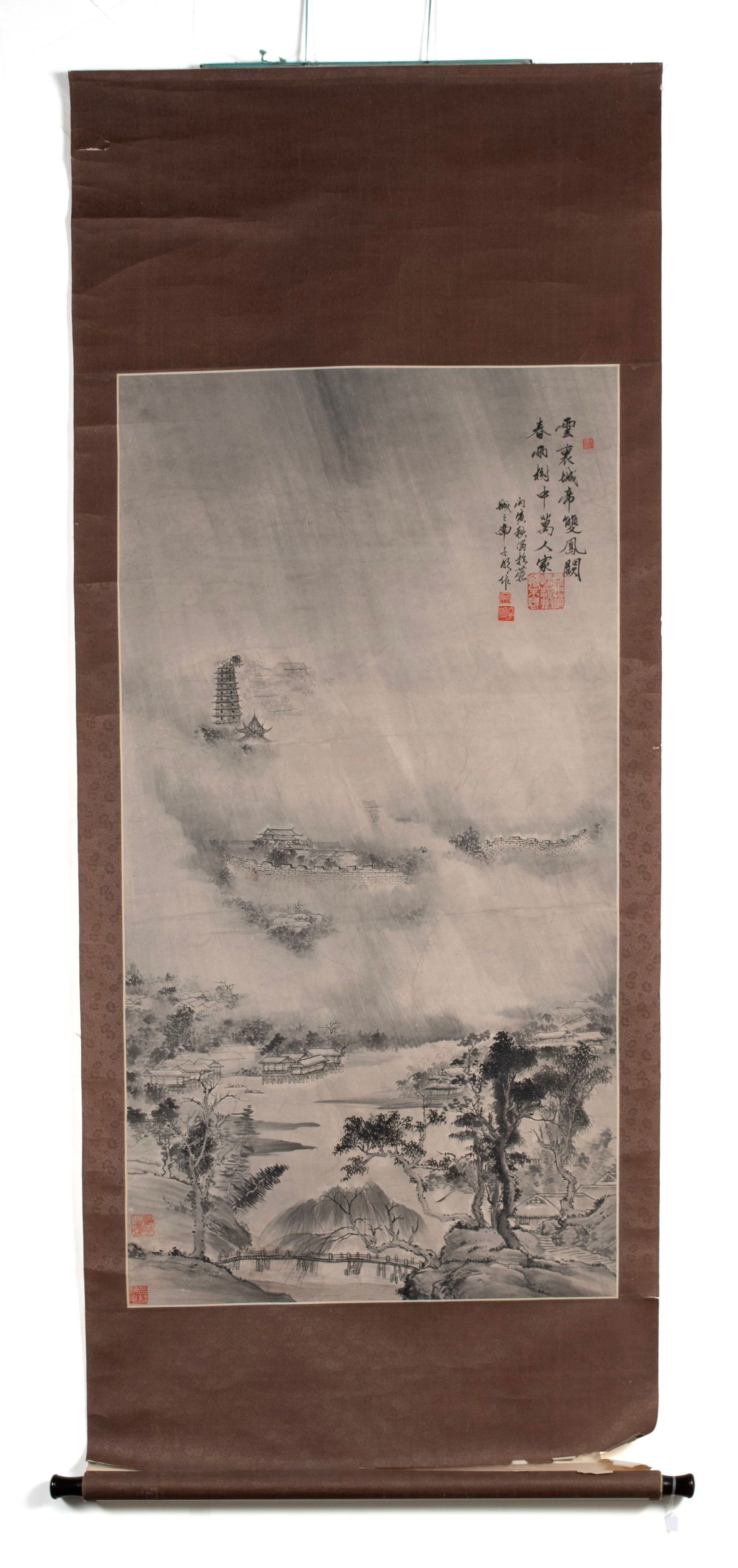 CHINESE PAINTED SCROLL IN THE MANNER OF WANG SU (1794-1877): CHINESE PAINTED SCROLL IN THE MANNER OF WANG SU (1794-1877)Chinese, 19th/20th century. Landscape in rain of the East Gate of Phoenix, signed with six red seals.74 x 29 1/2 in. (188 x 74.9 cm.)