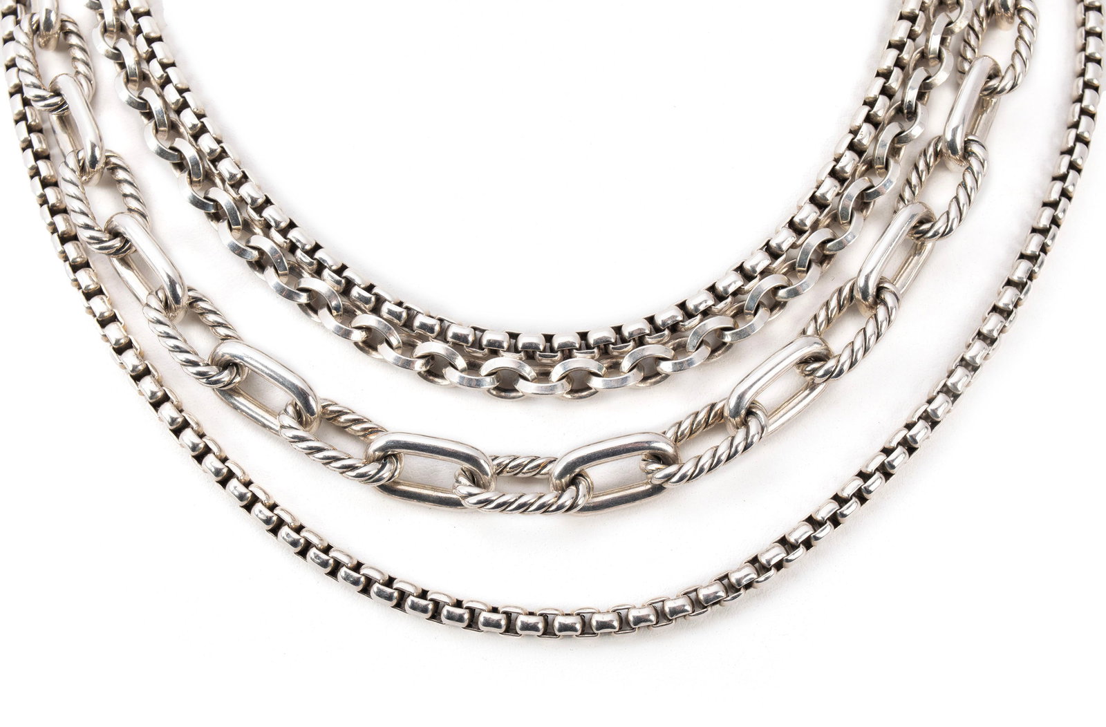 DAVID YURMAN MULTI STRAND STERLING SILVER NECKLACE: DAVID YURMAN MULTI STRAND STERLING SILVER NECKLACE A sterling silver four-strand necklace of chain links and box links ending in a toggle clasp. Hallmarked. Length: 19 in. (48.3 cm.); 170 grams