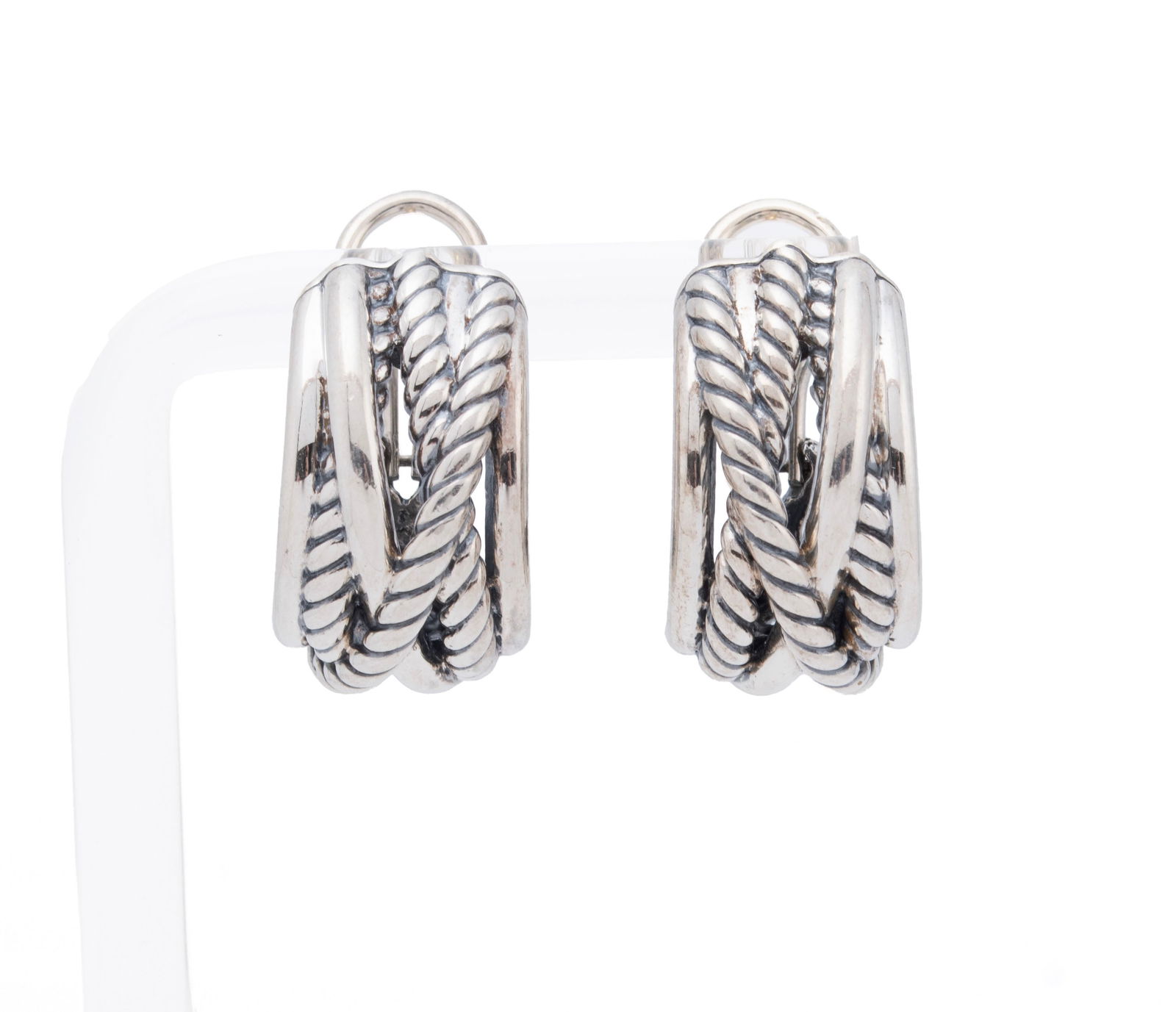 DAVID YURMAN CROSSOVER SHRIMP EARRINGS: DAVID YURMAN CROSSOVER SHRIMP EARRINGS A pair of sterling silver crossover cable and polished bands with hinged omega backs. Hallmarked. Each: 3/4 in. (1.9 cm.); 13 grams