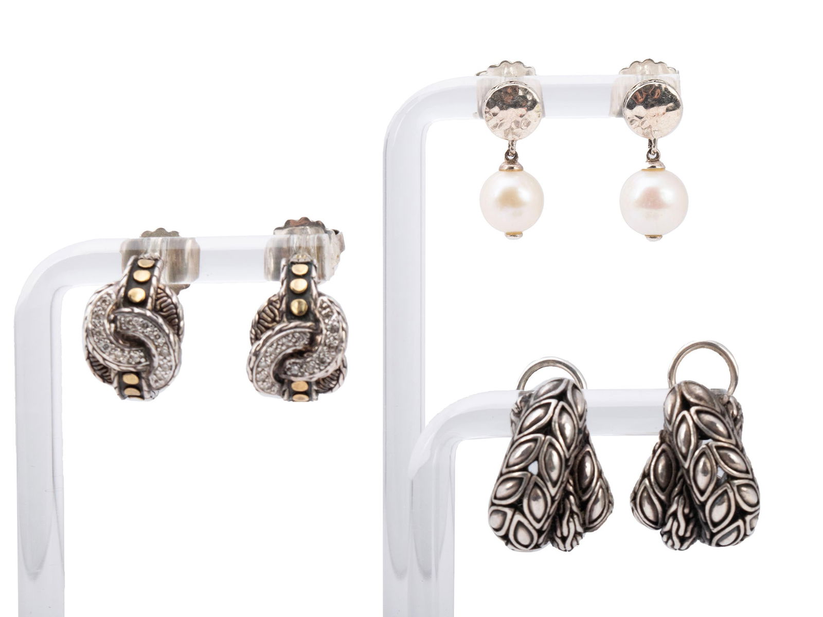 THREE PAIRS OF JOHN HARDY EARRINGS: THREE PAIRS OF JOHN HARDY EARRINGSOne (1) pair of sterling silver hoop earrings with 18k yellow gold dots and an intertwined knot with pave set diamond. One (1) pair of Padi leaf design sterling silve