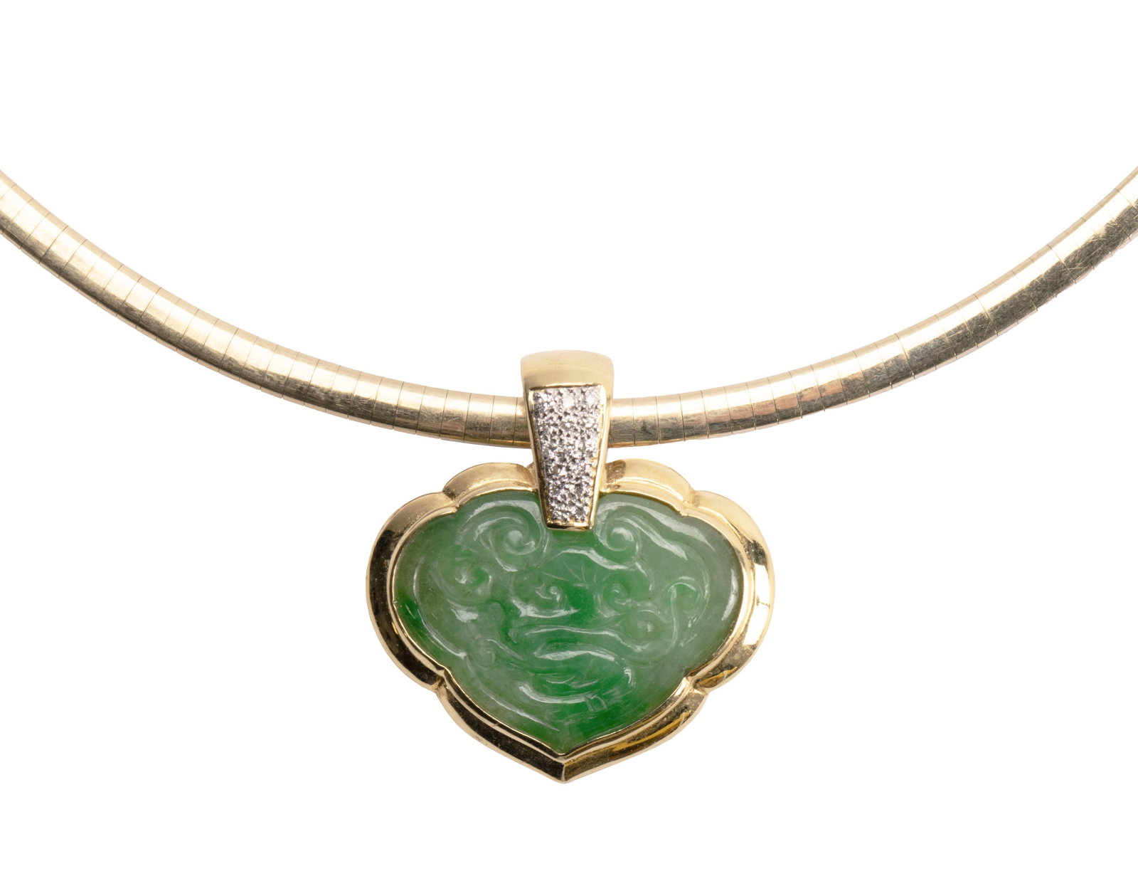 GOLD, DIAMOND, JADEITE PENDANT NECKLACE: GOLD, DIAMOND, JADEITE PENDANT NECKLACE An 18k yellow gold pendant set with one (1) carved green jadeite measuring approximately 1 inch x 3/4 inch and fifteen (15) round brilliant cut diamonds
