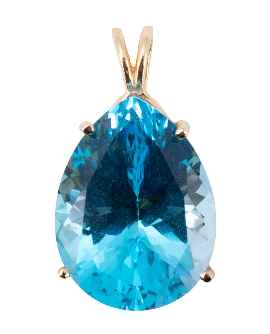 BLUE TOPAZ GOLD PENDANT: BLUE TOPAZ GOLD PENDANT A 14k yellow gold pendant set with one (1) pear cut faceted blue topaz measuring 20mm x 15mm. RI.1.61; 5.8 grams; total length 1 in.