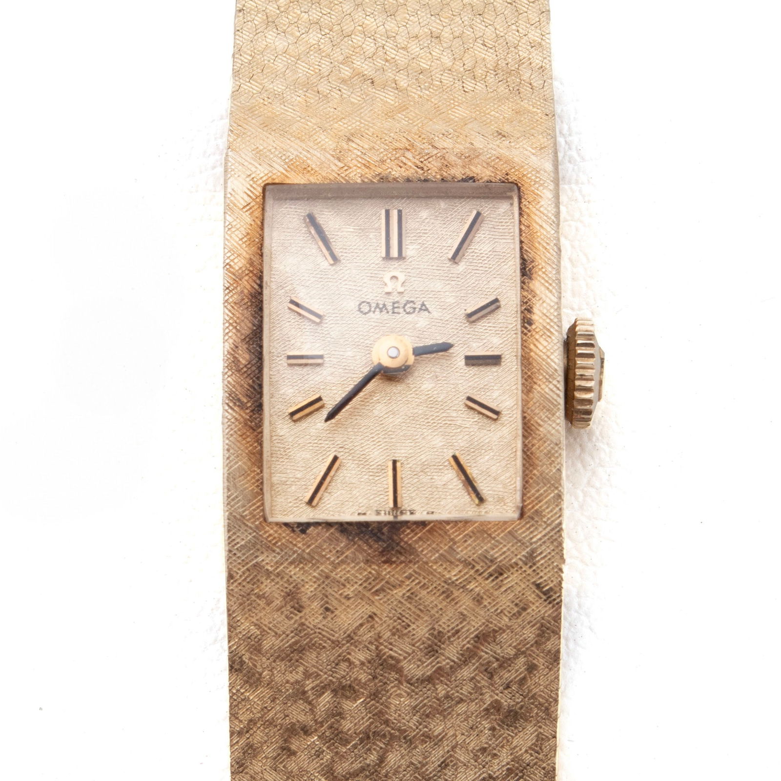 OMEGA GOLD BRACELET WATCH: OMEGA GOLD BRACELET WATCH A 1y yellow gold lady's manual wind watch with mesh bracelet. With original box. Length: 6 1/8 in. (15.6 cm.); 34 grams