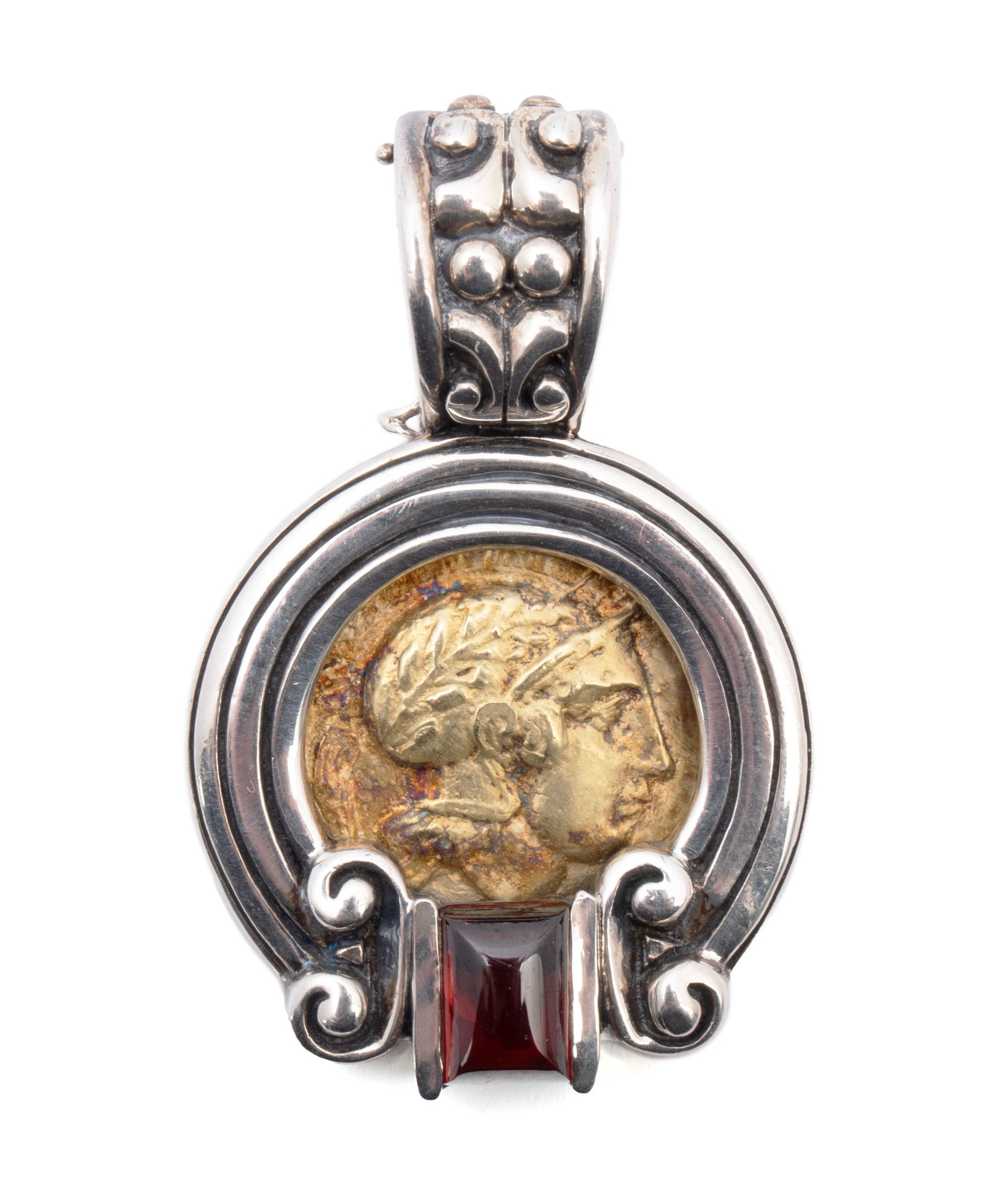 ESTI FREDERICA ROMAN COIN GOLD PENDANT: ESTI FREDERICA ROMAN COIN GOLD PENDANT A sterling silver slide pendant set with an 18k yellow gold center coin design of a Roman soldier and a cabochon cut rectangular garnet measuring 8mm x 5.3mm.