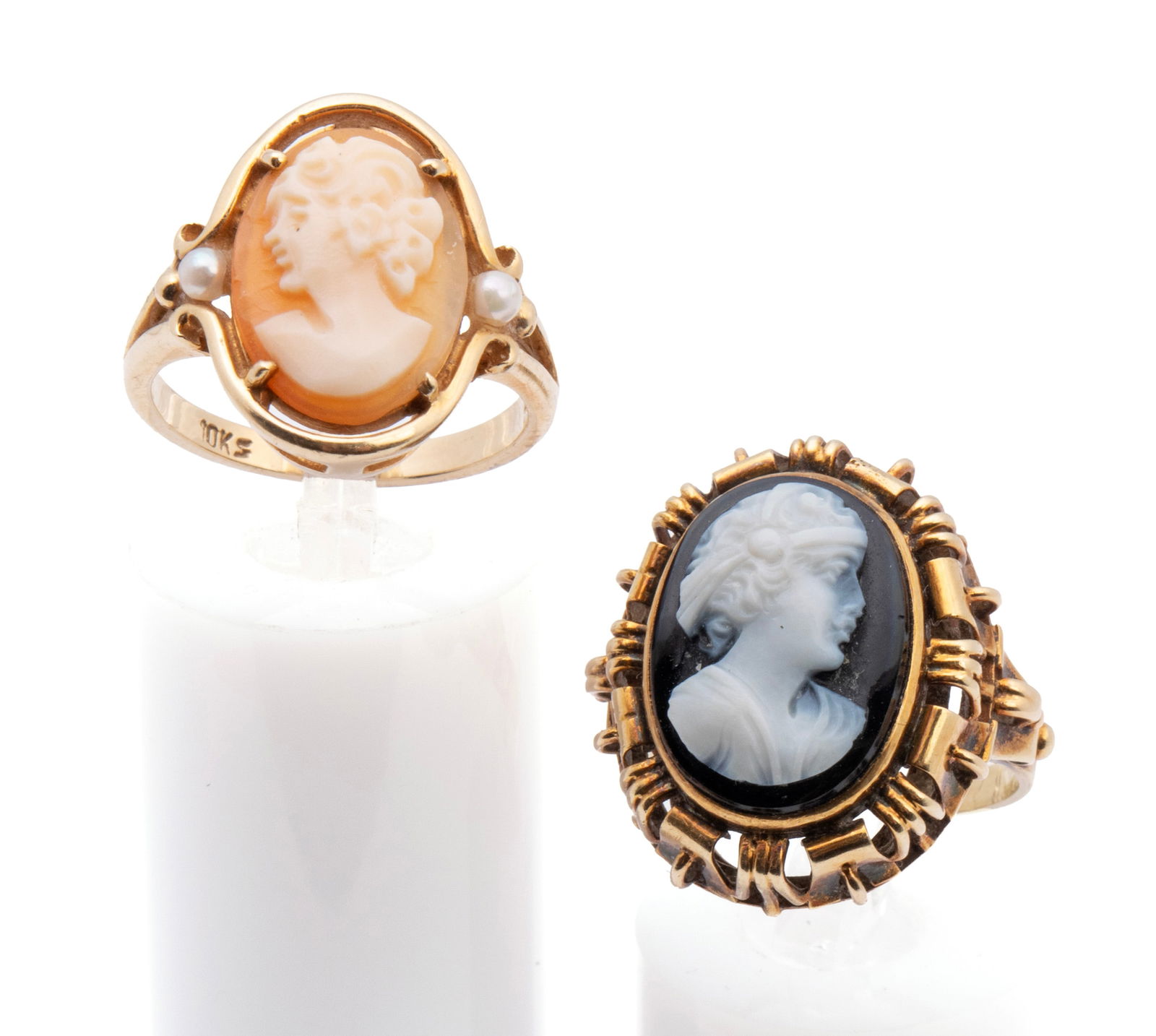 TWO CAMEO RINGS: TWO CAMEO RINGS A 14k yellow gold ring set with one (1) oval black and white cameo measuring 15.5mm x 11.5mm and a 10k yellow gold ring set with one (1) oval cameo measuring 14mm x 10mm with two (2)