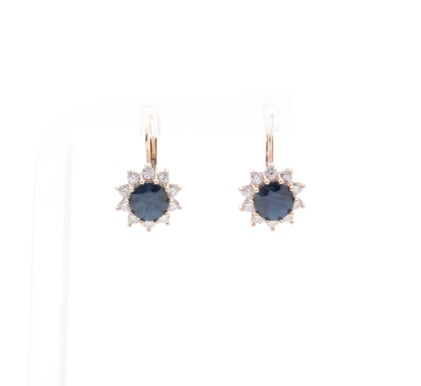 SAPPHIRE AND DIAMOND EARRINGS: SAPPHIRE AND DIAMOND EARRINGS A pair of 14k yellow gold pierced earrings with lever backs set with two (2) round faceted 6mm sapphires surrounded by twenty (20) round brilliant cut diamonds weighing