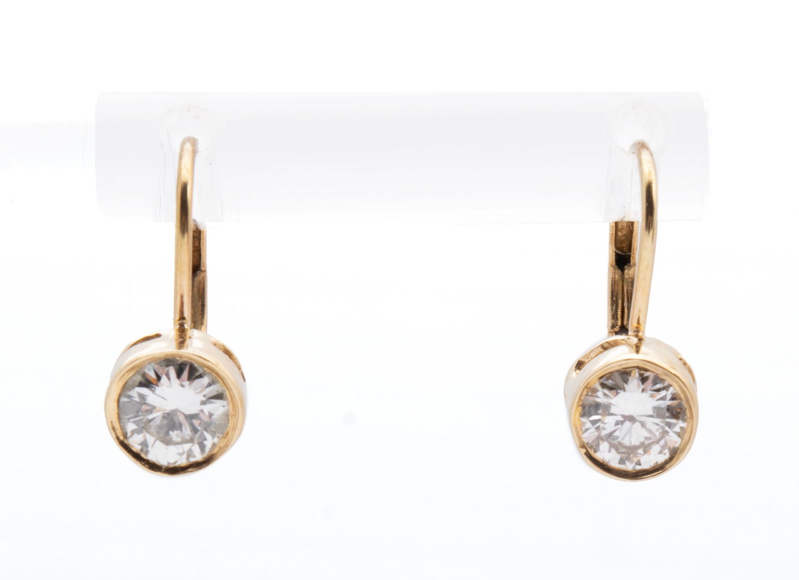 DIAMOND GOLD EARRINGS: DIAMOND GOLD EARRINGS A pair of 14k yellow gold pierced earrings with lever backs set with two (2) round brilliant cut diamonds weighing approximately 0.33ct. each. 2 grams