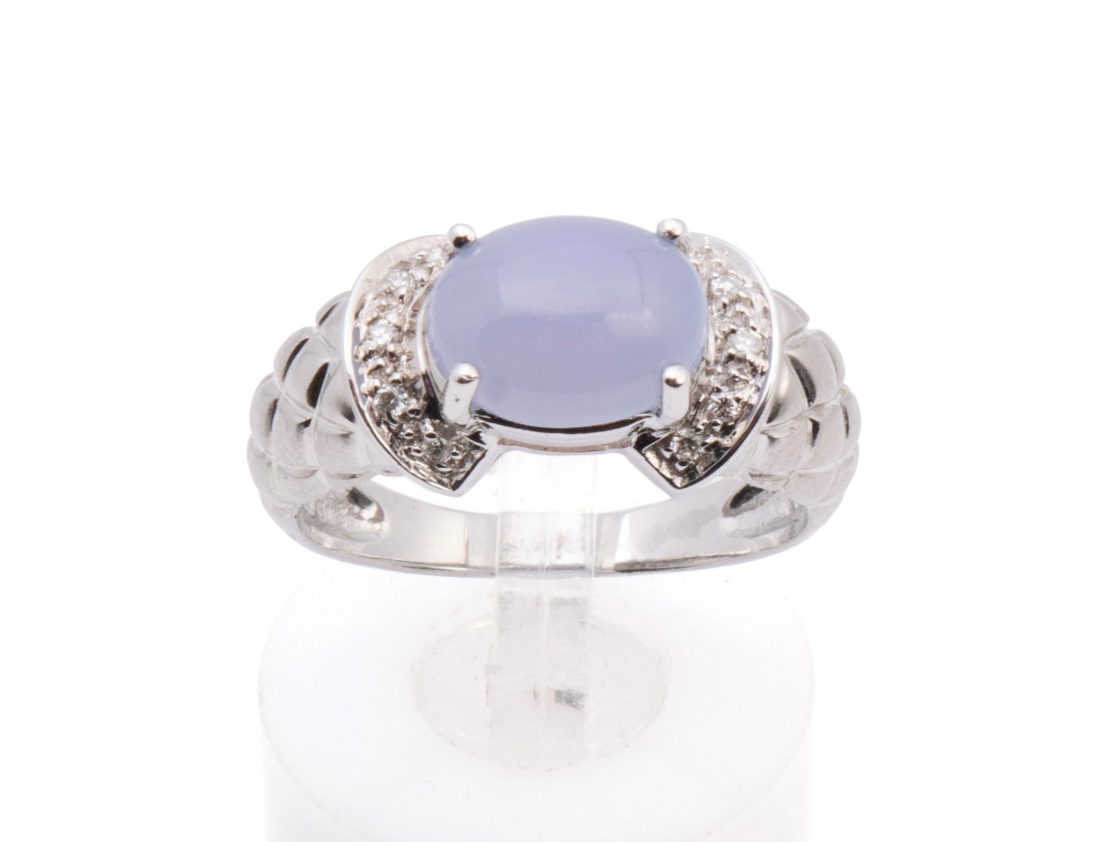 CHALCEDONY DIAMOND WHITE GOLD RING: CHALCEDONY DIAMOND WHITE GOLD RING A 14k white gold ring set with one (1) oval cabochon cut chalcedony 9mm x 7mm with ten (10) round brilliant cut diamonds weighing approximately 0.10ctw. Size: 5.75;