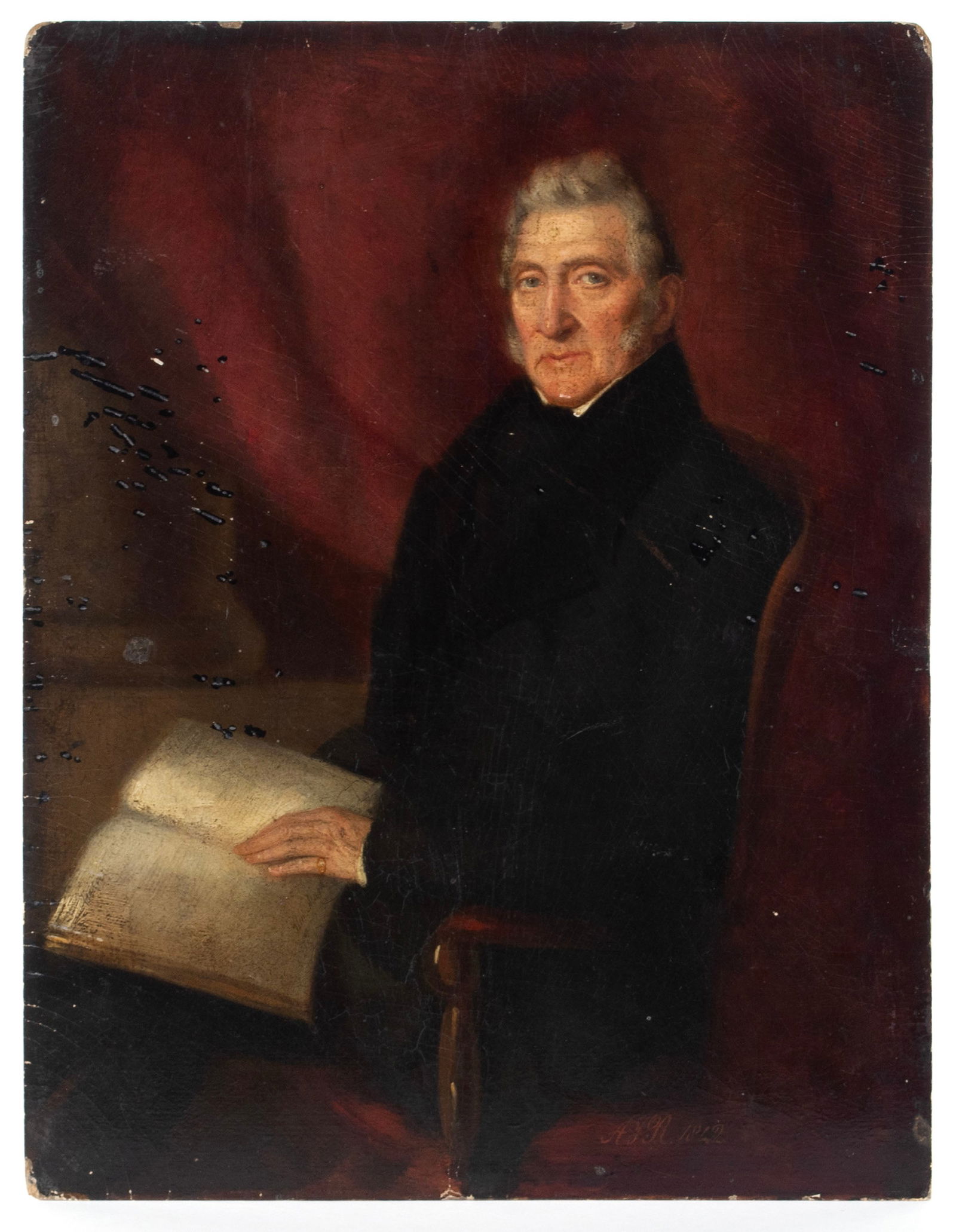 PORTRAIT OF A MAN: PORTRAIT OF A MANOil on period artist board, signed "A F R 1842". Seated gentleman with an open book, against a red curtain, unframed. Artist board stenciled to verso "Gt. Russell St. - LONDON", appar