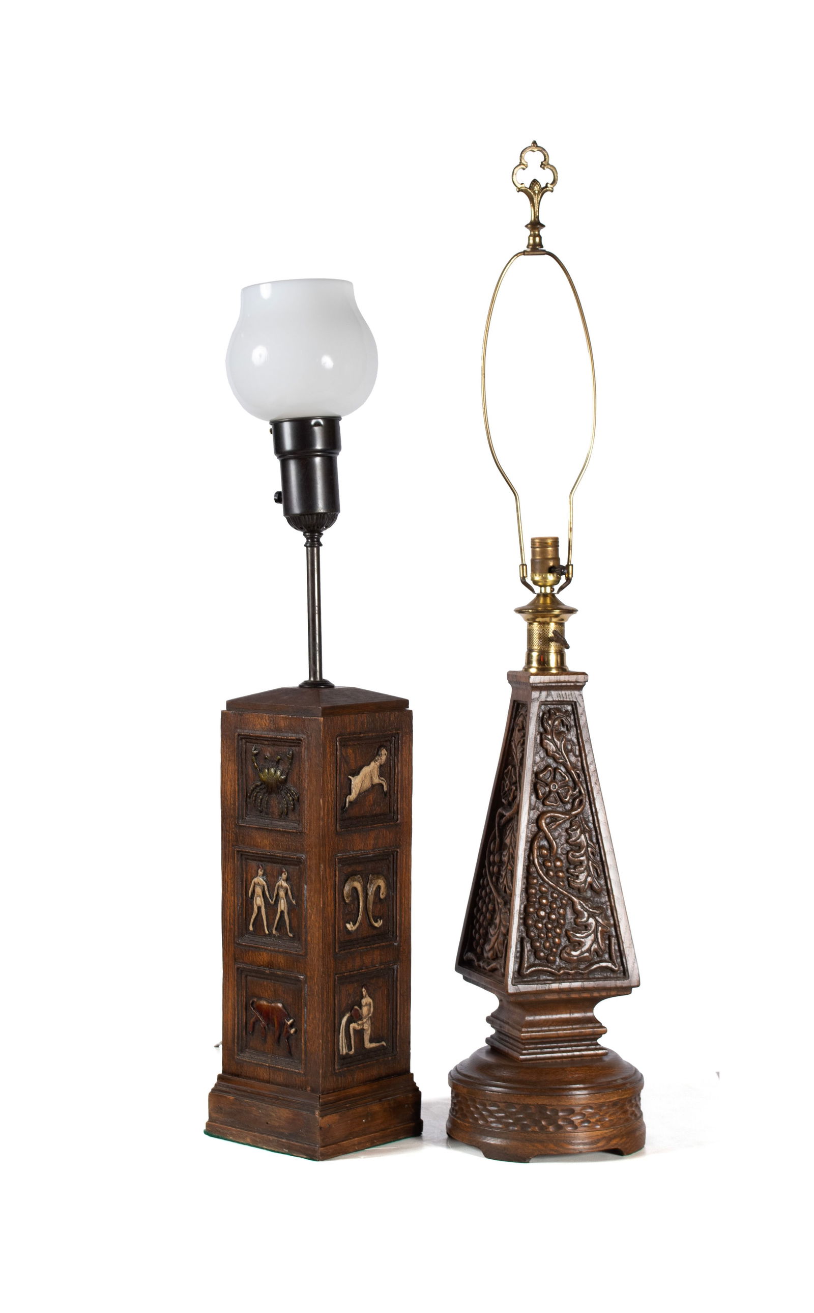 TWO ROMWEBER VIKING OAK TABLE LAMPS: TWO ROMWEBER VIKING OAK TABLE LAMPSAmerican, 20th century. One (1) a square 'zodiac' lamp, the other triangular with grapevine decoration.Larger: 44 1/2 x 8 x 8 in. (113 x 20.3 x 20.3 cm.)