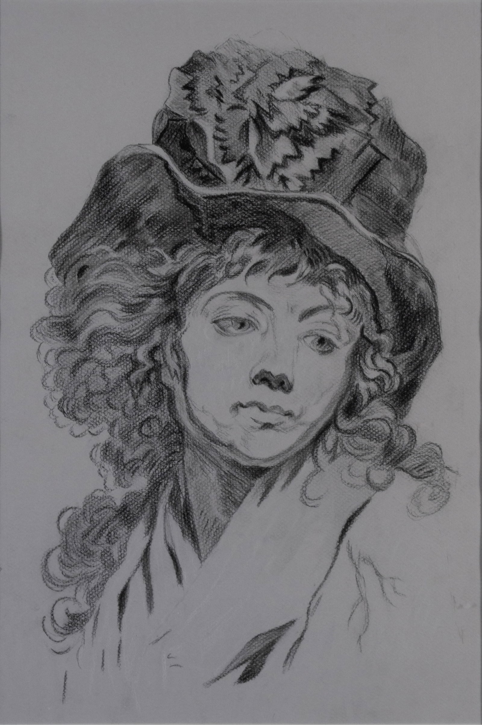 AFTER CLAUDE-JEAN HOUIN (FRENCH, 1750-1817), PORTRAIT OF A WOMAN: AFTER CLAUDE-JEAN HOUIN (FRENCH, 1750-1817), PORTRAIT OF A WOMAN Late 19th/early 20th century, charcoal on paper, unsigned. Bust length portrait of a woman in a hat, matted and framed. 17 x 11 1/2