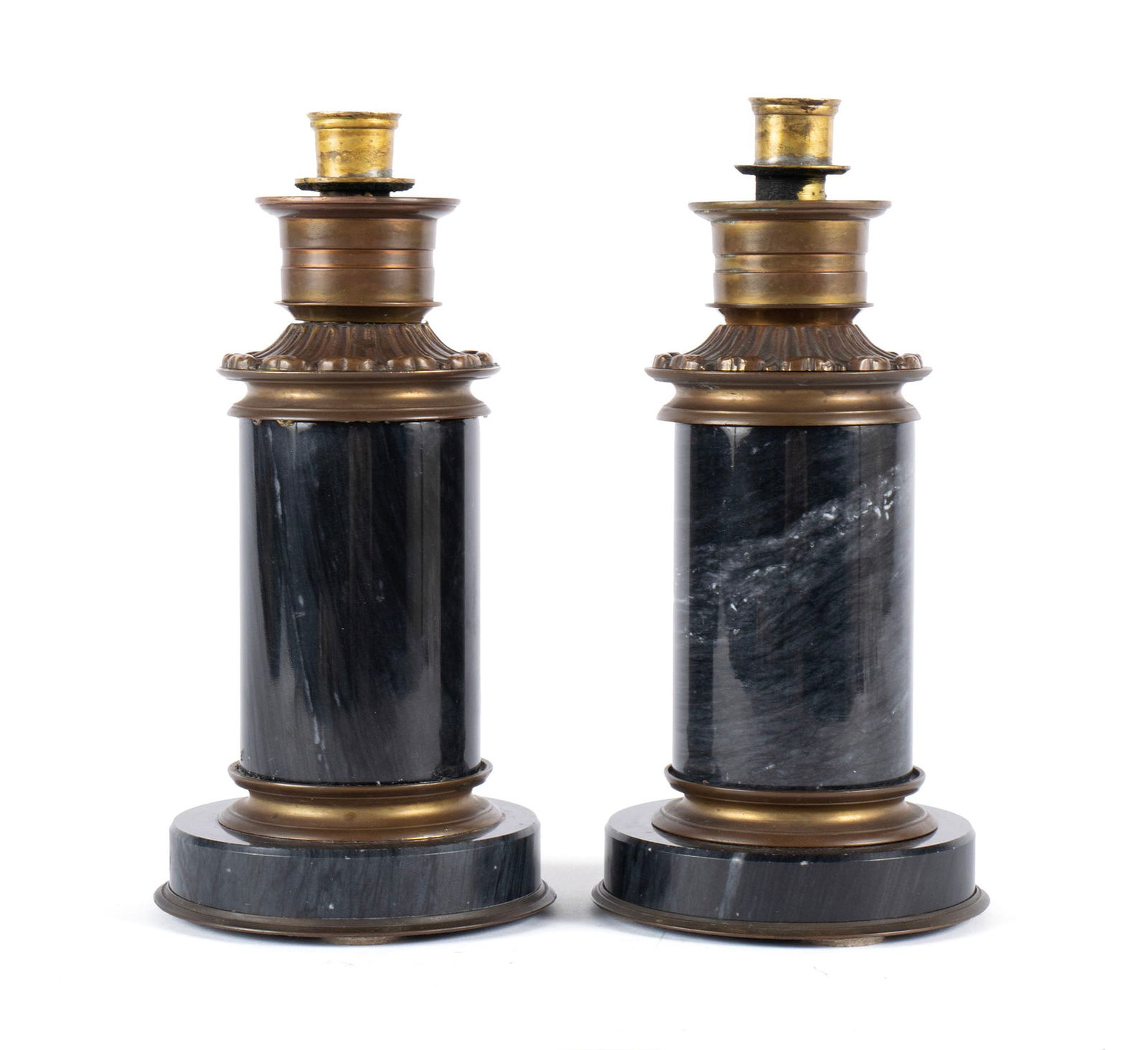 PAIR OF EMPIRE STYLE CANDLESTICKS: PAIR OF EMPIRE STYLE CANDLESTICKS Continental, 19th / 20th century. Gilt metal mounts around the thick green marble stems, on round bases. Each: 10 x 5 x 5 in. (25.4 x 12.7 x 12.7 cm.)