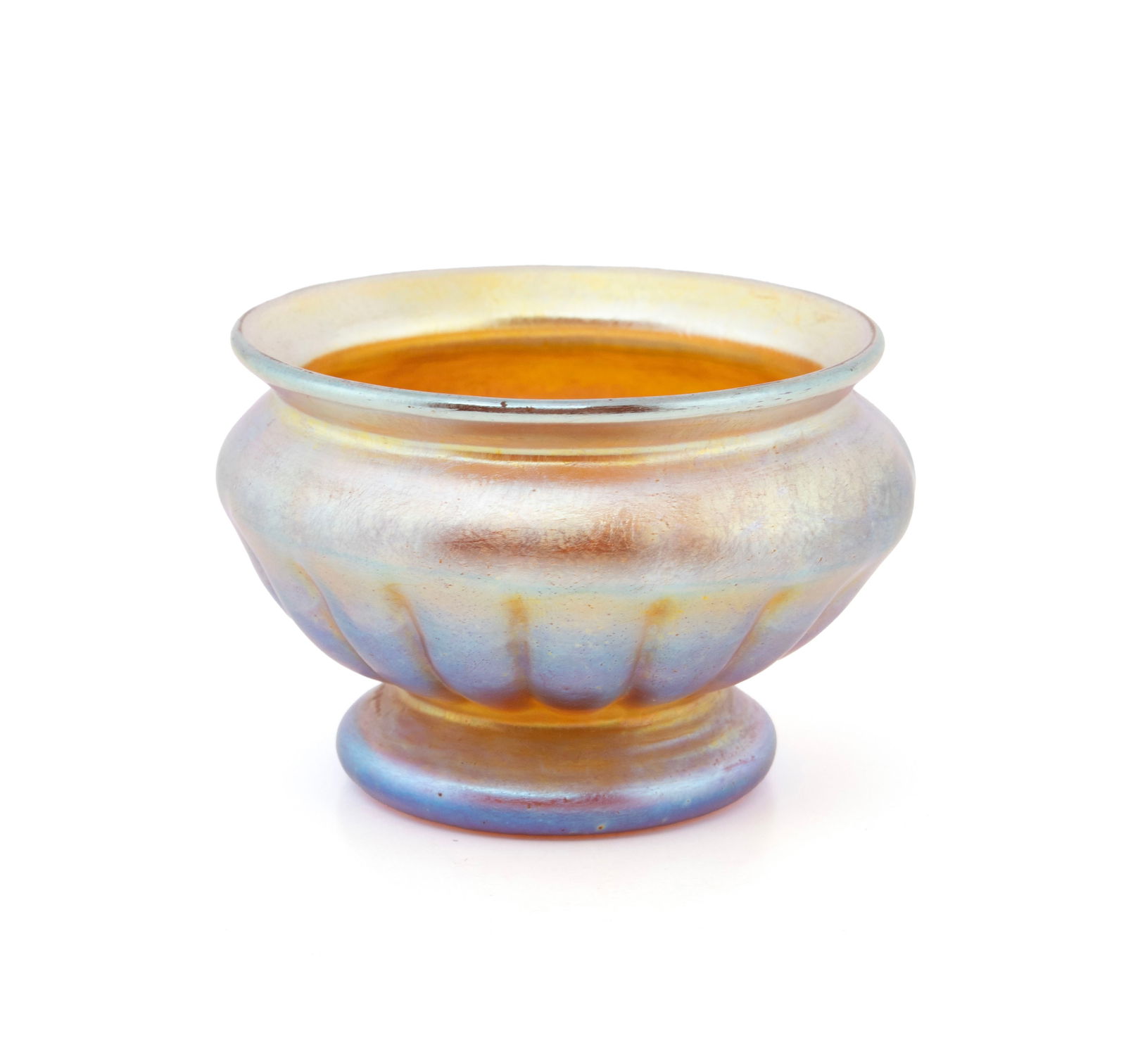 TIFFANY FAVRILE GLASS OPEN SALT DISH: TIFFANY FAVRILE GLASS OPEN SALT DISH American, early 20th century, signed "6942B L.C.T." Ribbed circular design on circular footing. 1.7 x 2 1/2 x 2 1/2 in. (4.3 x 6.4 x 6.4 cm.)