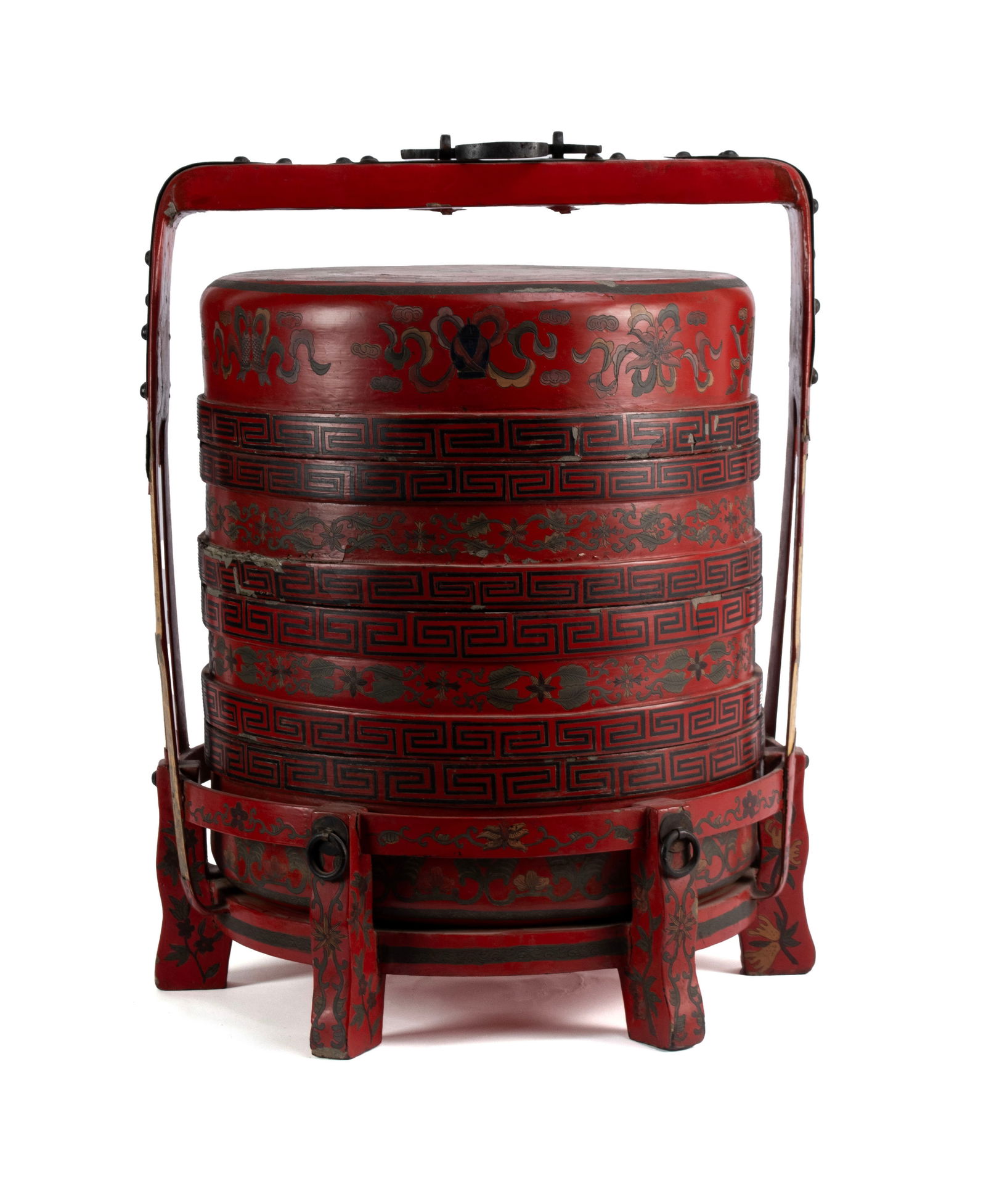 CHINESE WEDDING BASKET: CHINESE WEDDING BASKET 19th/20th century. Red lacquered, three baskets and a lid in a fitted stack, decorated with Asian motifs to the red ground, all stacked in a matching fitted stand with metal