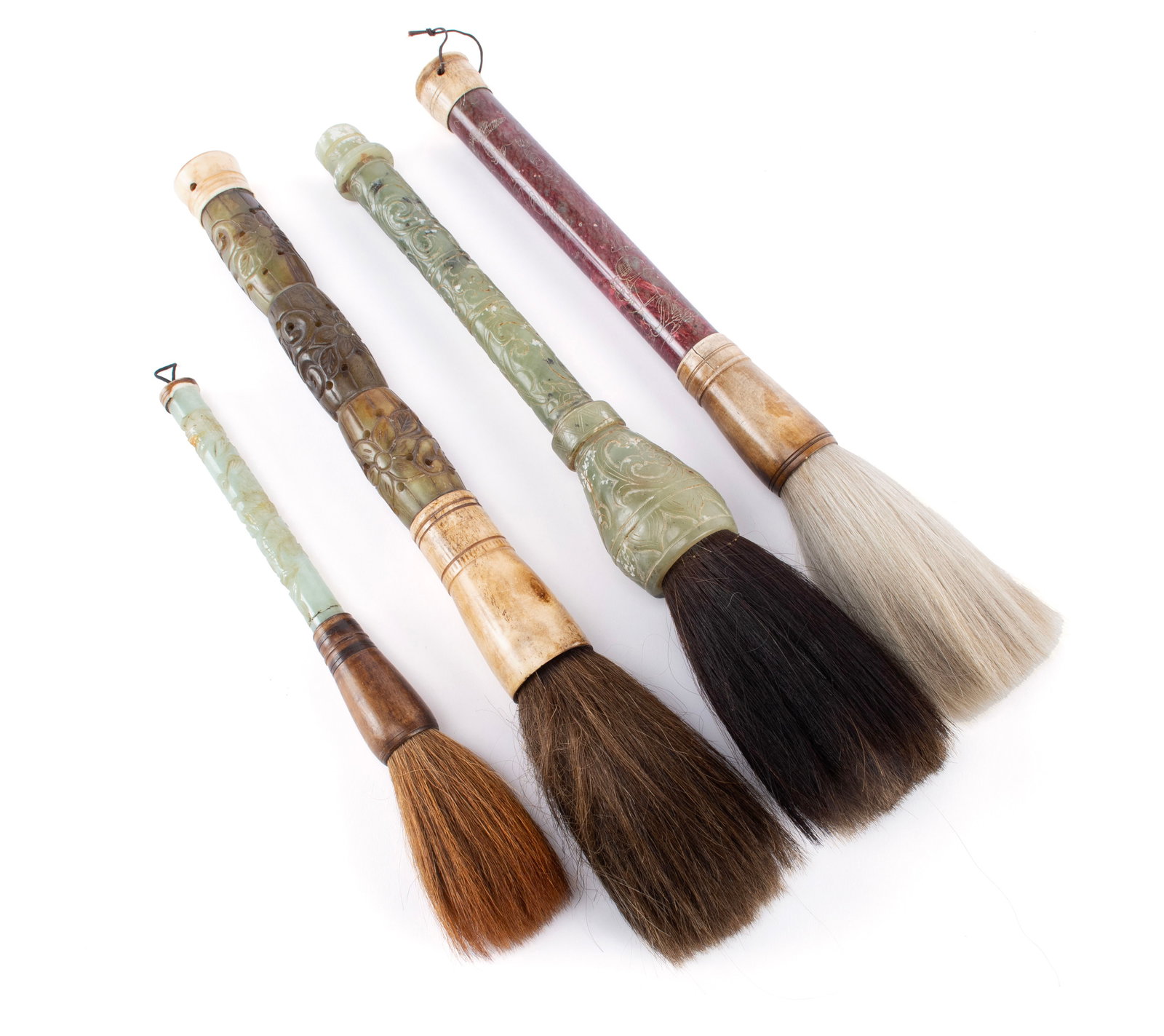 FOUR CHINESE BRUSHES: FOUR CHINESE BRUSHES 20th century. Four (4) brushes with jade and hardstone handles. 15 x 3 in. (38.1 x 7.6 cm.)