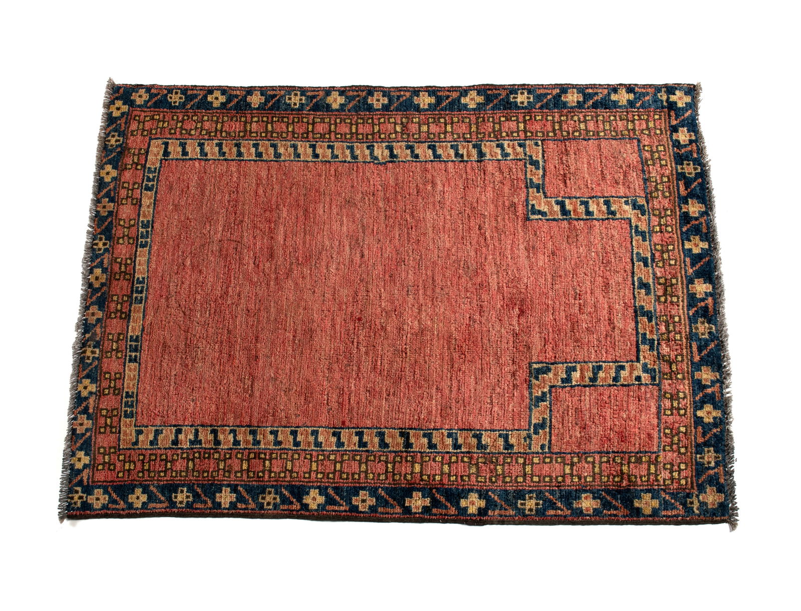 PERSIAN DIRECTIONAL PRAYER RUG: PERSIAN DIRECTIONAL PRAYER RUG Persian, 20th century. Open red field with matching upper corners, borders or ochre, red and outermost navy, all with geometric designs. 3 ft. 10 in. x 2 ft. 8 in.