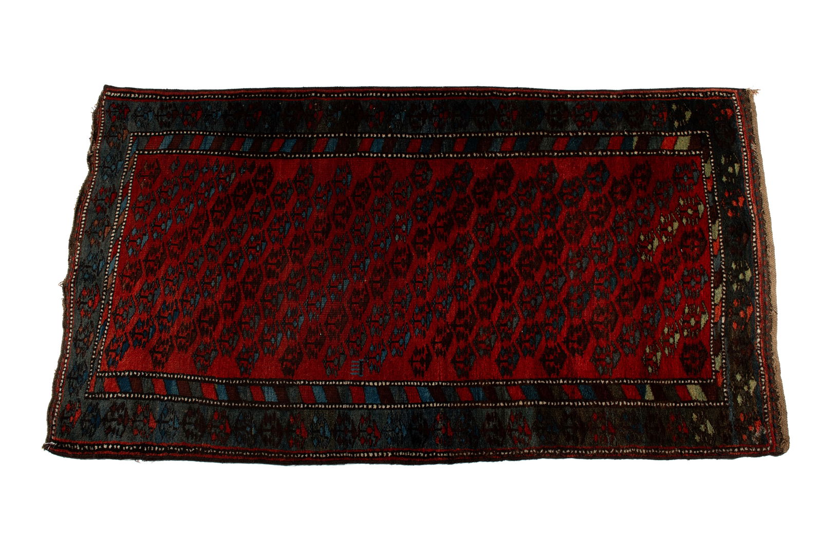 PERSIAN AREA RUG: PERSIAN AREA RUGPersian, 20th century. Angled rows with 'landscape' medallions on the red field, navy border with matching medallions and multiple guard borders.6 ft. 8 in. x 3 ft. 9 in.