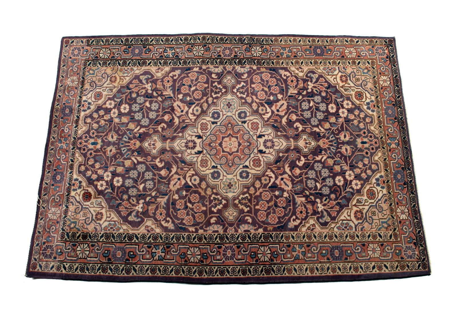 JOZAN AREA RUG: JOZAN AREA RUG Persian, 20th century. Ivory medallion centers the floral decorated navy field with ivory to soft red corners, red border with ivory guard borders. 5 ft. 8 in. x 3 ft. 11 in.