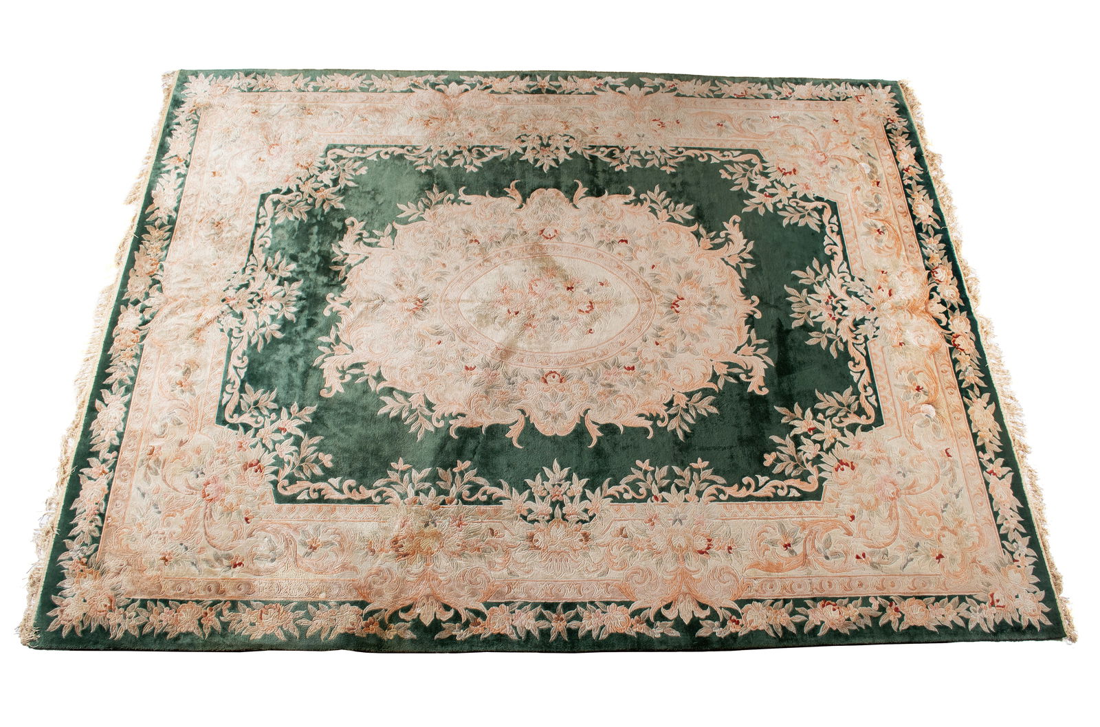 SAVONAROLA DESIGN ROOM RUG: SAVONAROLA DESIGN ROOM RUG Chinese, 20th century, silken cotton. Large foliate medallion centers the forest green field, the primary border of foliate designs in shades of peach, grey and ivory, the