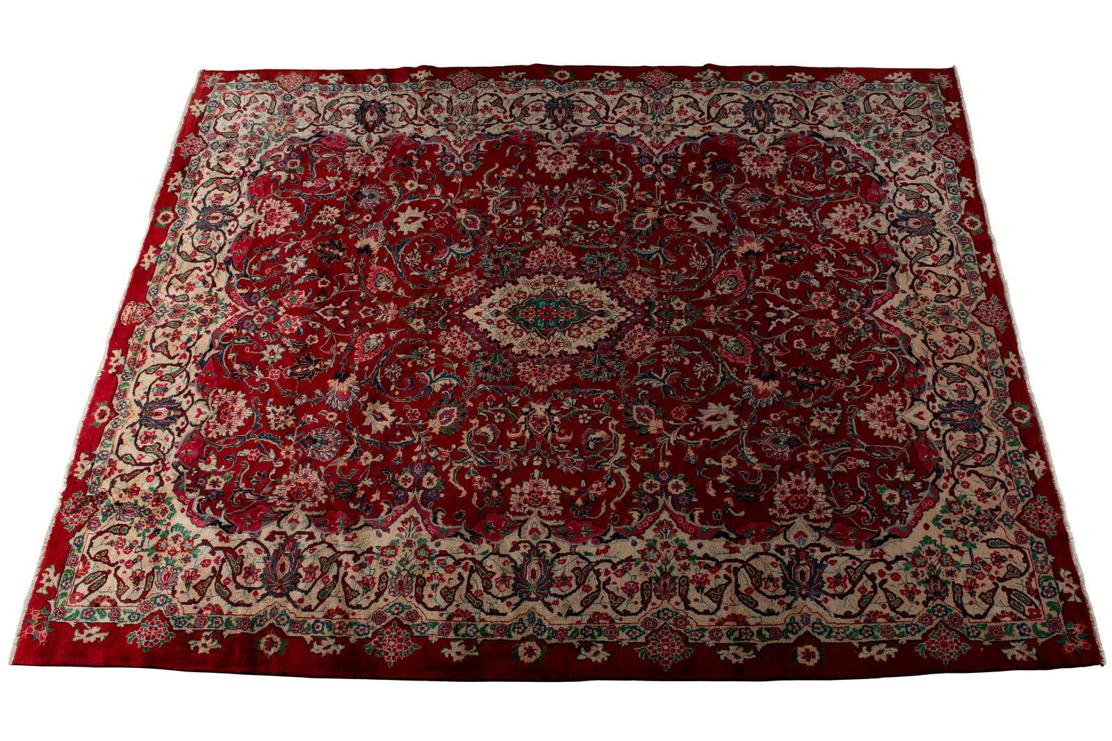MAHAL ROOM RUG: MAHAL ROOM RUG Persian, 20th century. Green on ivory foliate medallion centers the floral decorated red field, with all around shaped ivory border, with an outer floral guard border. 12 ft. 6 in. x 9