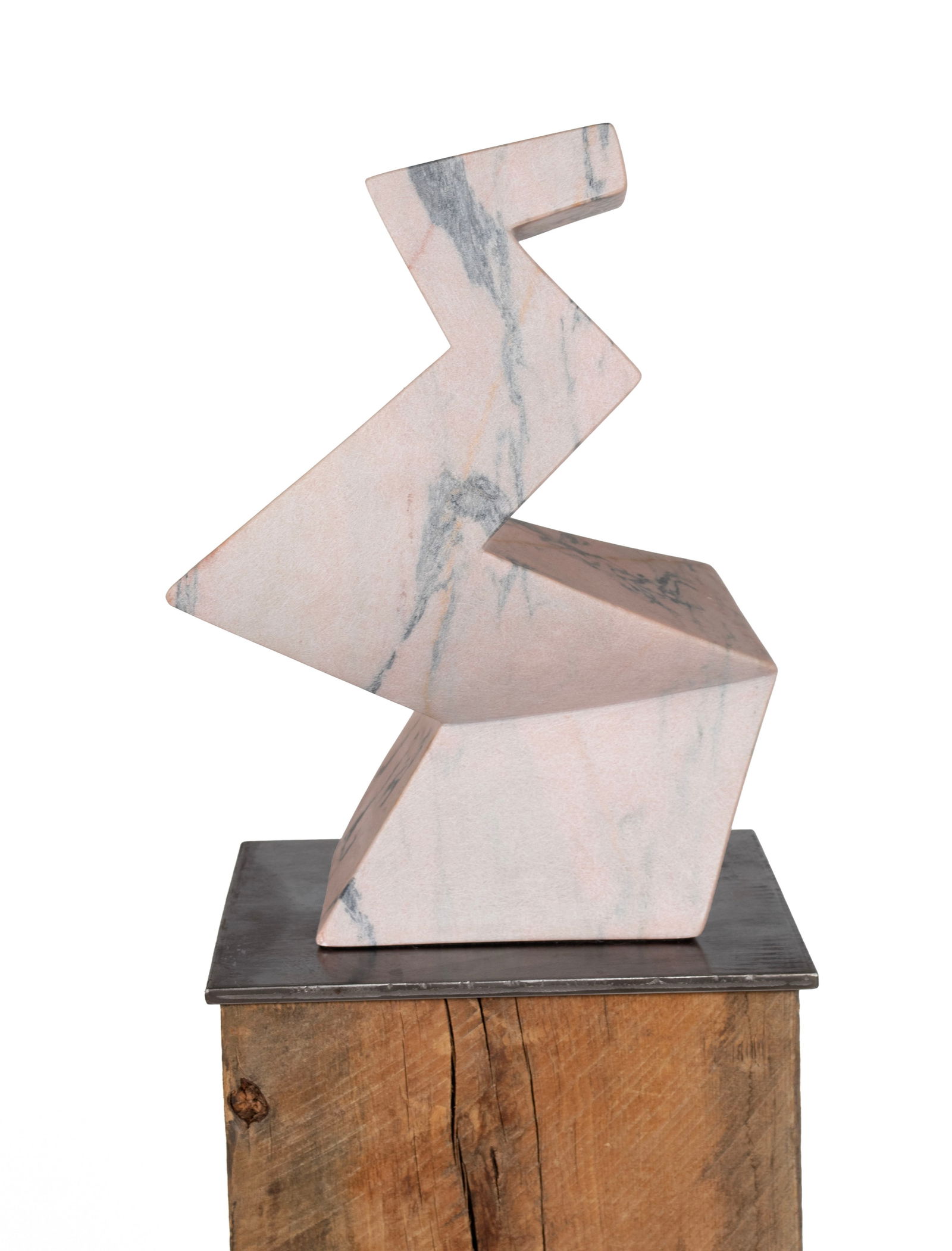 MODERNIST MARBLE SCULPTURE: MODERNIST MARBLE SCULPTURE Pink marble sculpture with grey veining, sculpted with angular forms, unsigned. On a thick wooden beam pedestal with square metal plate top. Pedestal: 38 1/2 x 12 x 12 in.