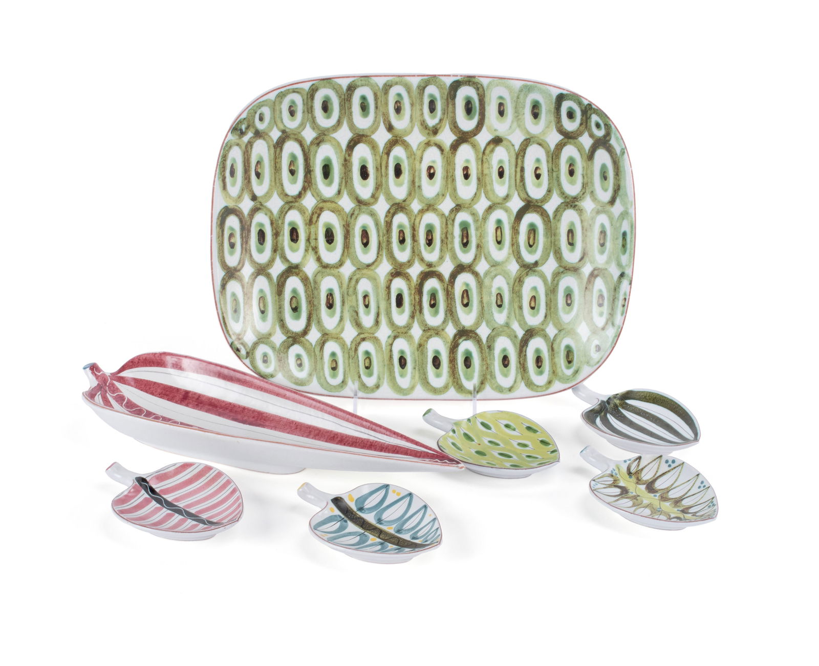 GROUP OF STIG LINDBERG FAIENCE: GROUP OF STIG LINDBERG FAIENCE Swedish, 20th century. Seven (7) hand painted pieces designed by Stig Lindberg (Swedish, 1916-1982) including six (6) leaf form dishes and one (1) platter, all numbered