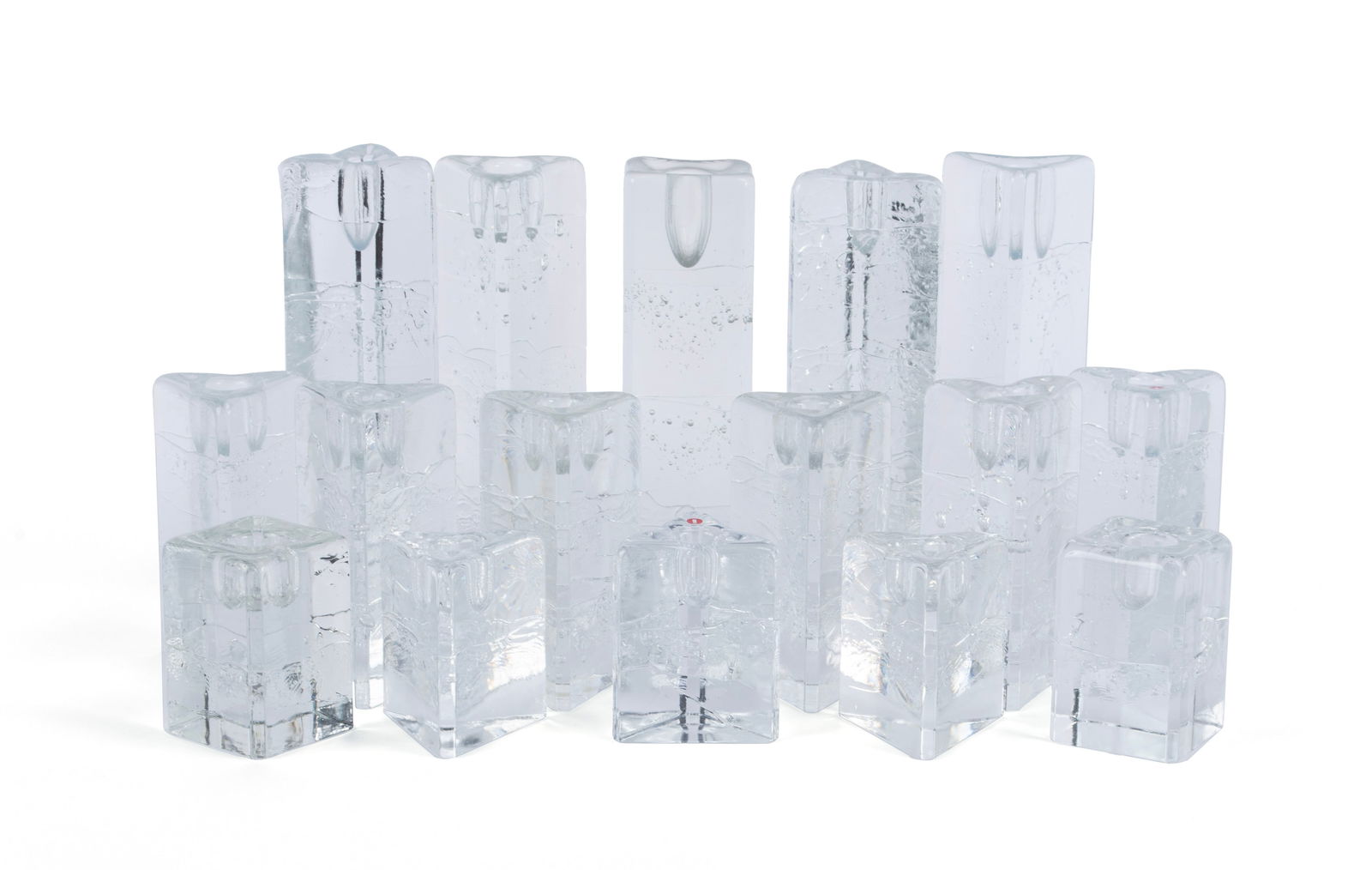 'ARKIPELAGO' CANDLEHOLDERS DESIGNED BY TIMO SARPANEVA (FINNISH, 1926-2005): 'ARKIPELAGO' CANDLEHOLDERS DESIGNED BY TIMO SARPANEVA (FINNISH, 1926-2005) Produced by Iittala Glasbruk of Iittala, Finland, circa 1979-81. Set of sixteen (16) cast glass candleholders, including