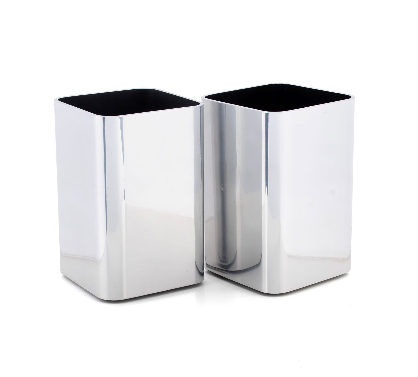 PAIR OF WILLIAM SKLAROFF 'RADIUS ONE' VASES: PAIR OF WILLIAM SKLAROFF 'RADIUS ONE' VASES Manufactured by Smith Metal Arts of Buffalo, NY, circa 1960s. Pair of aluminum planters/vases from the 'Radius One' line, labeled on underside. Each: 9 x 6
