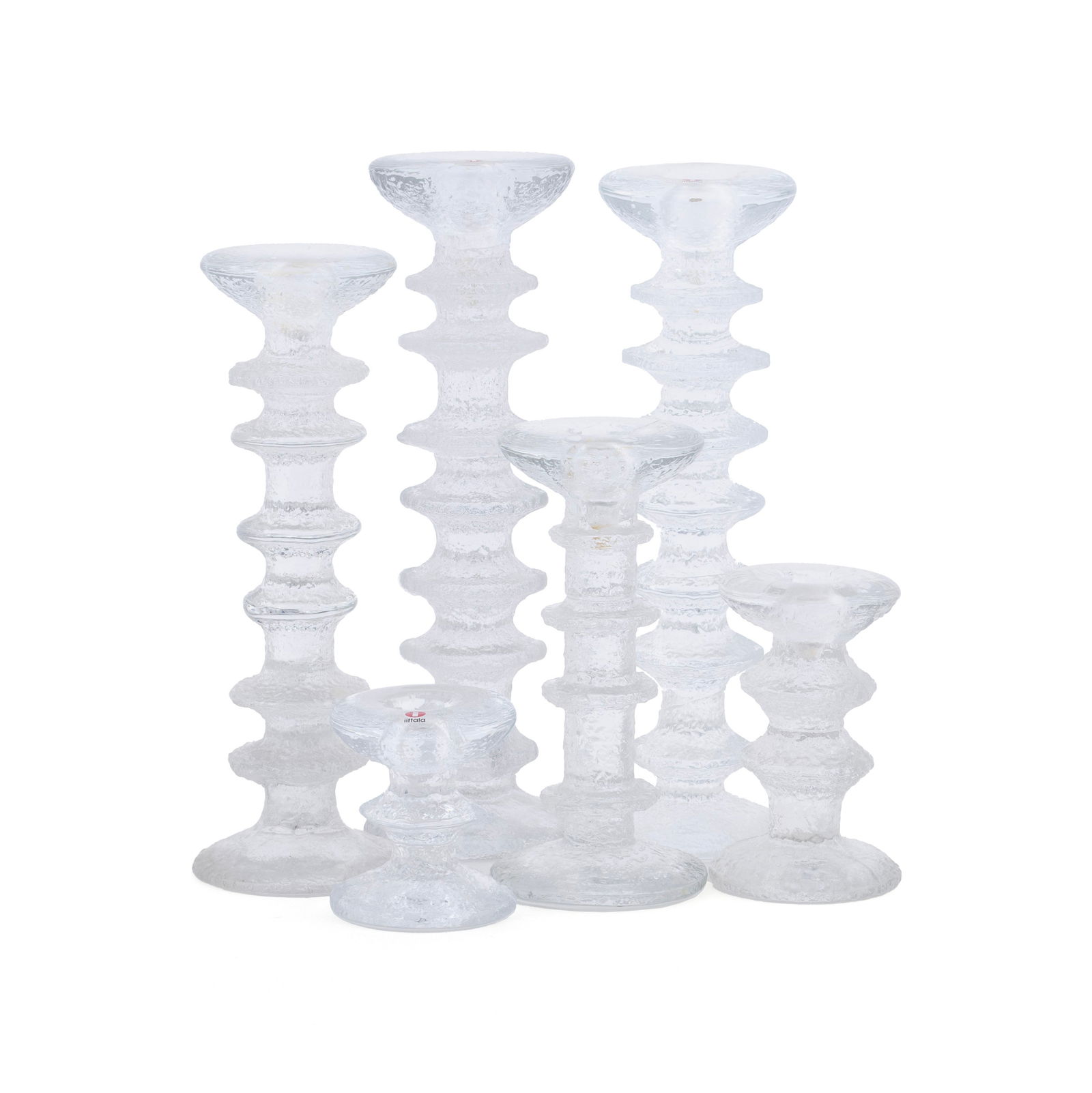 SET OF 'FESTIVO' CANDLESTICKS DESIGNED BY TIMO SARPANEVA (FINNISH, 1926-2005) (25): SET OF 'FESTIVO' CANDLESTICKS DESIGNED BY TIMO SARPANEVA (FINNISH, 1926-2005) (25)Iittala, Finland, circa 1967. Set of twenty-five (25) ?Festivo? Candlesticks in an ice-block design. Some signed TS on