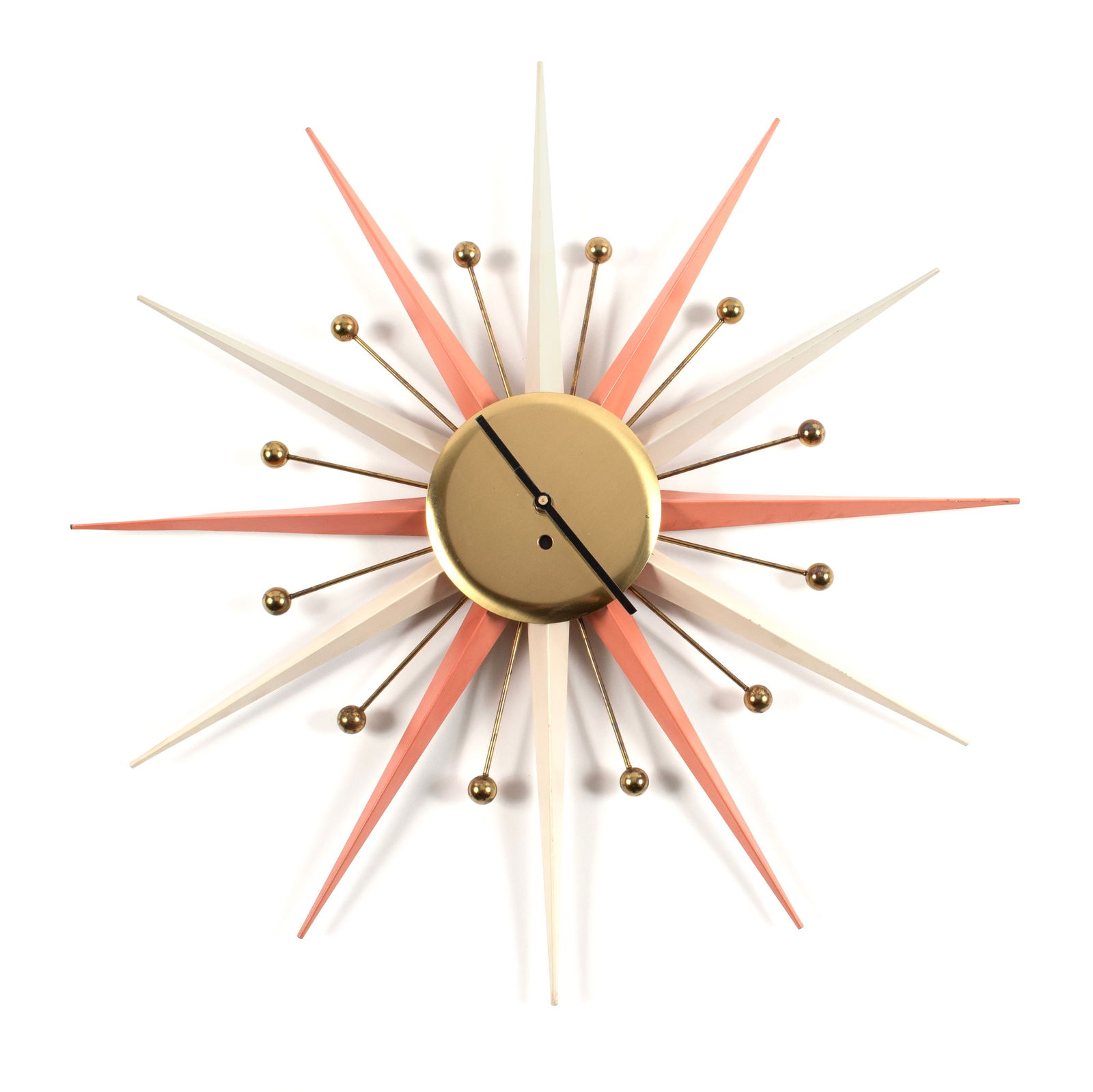 MCM STARBURST CLOCK: MCM STARBURST CLOCK 20th century. Brass and painted metal, battery operated. 25 x 25 in. (63.5 x 63.5 cm.)