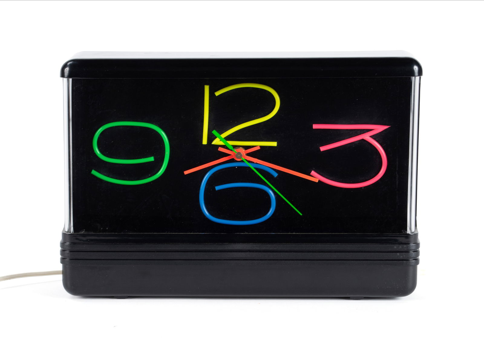 MODERN "NEON DESIGNS CLOCK" IN BOX: MODERN "NEON DESIGNS CLOCK" IN BOX American, 1988, new in box with original packing and instruction sheet, by Seville Classics, Gardena, CA. Black plastic case, electric with quartz movement. Clock: