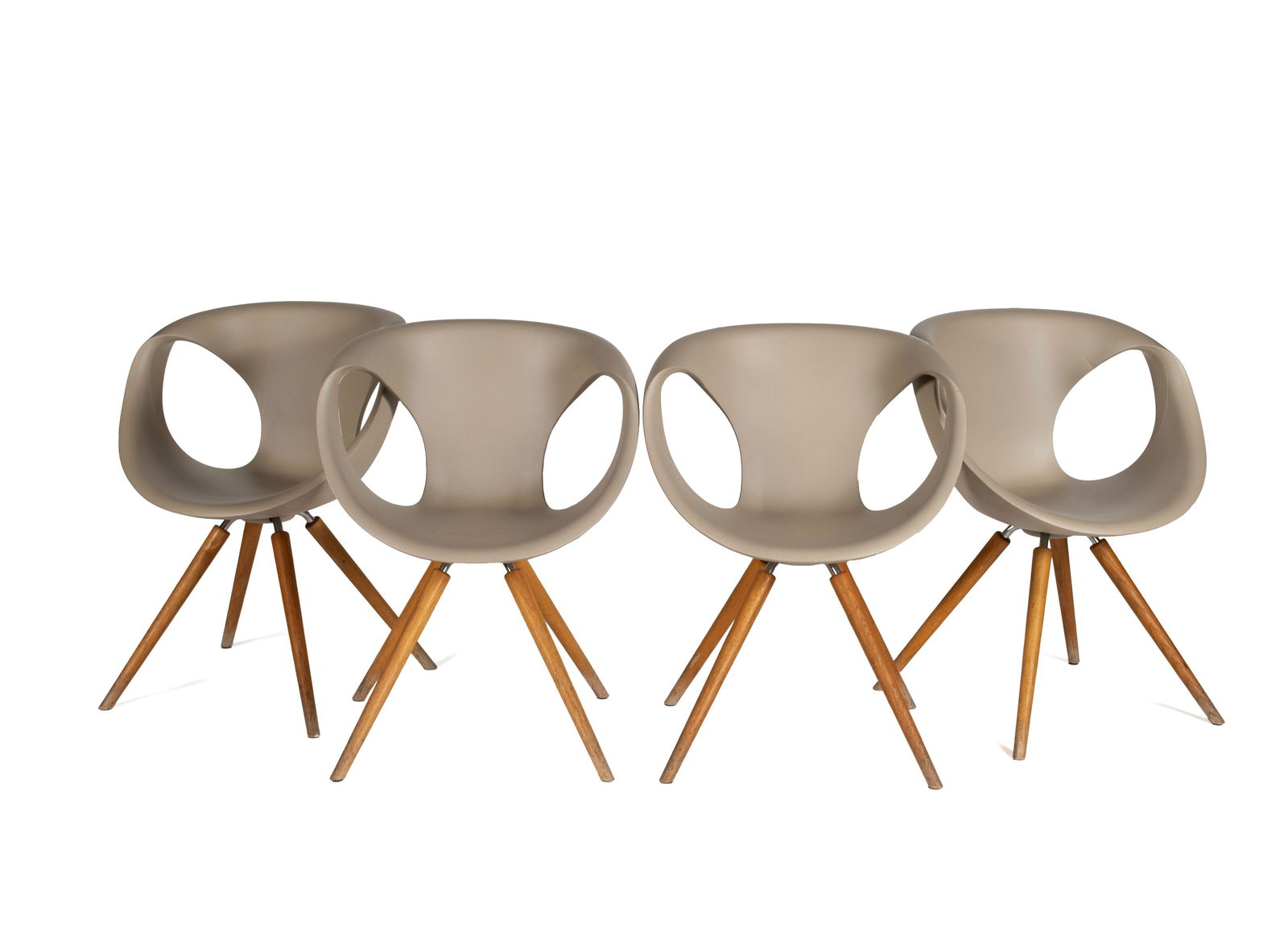 FOUR 'UP' CHAIRS BY TONON: FOUR 'UP' CHAIRS BY TONON Italian, designed by Martin Ballendat. Four (4) chairs with tan polyurethane shells on wooden legs, marked under seat. Each: 32 1/4 x 24 in. (81.9 x 61 cm.) Collection of