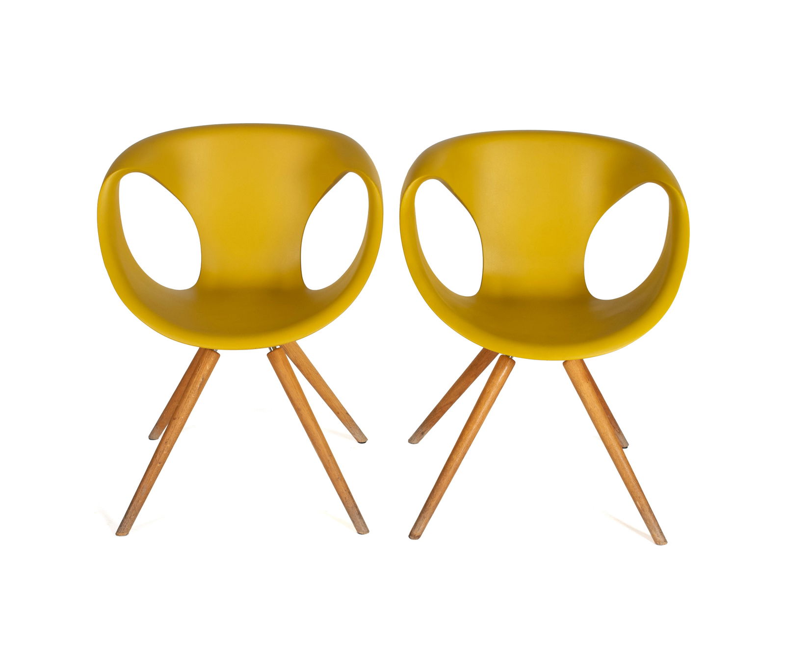 TWO 'UP' CHAIRS BY TONON: TWO 'UP' CHAIRS BY TONON Italian, designed by Martin Ballendat. Two (2) chairs with mustard polyurethane shells on wooden legs, marked under seat. Each: 32 1/4 x 24 in. (81.9 x 61 cm.) Collection