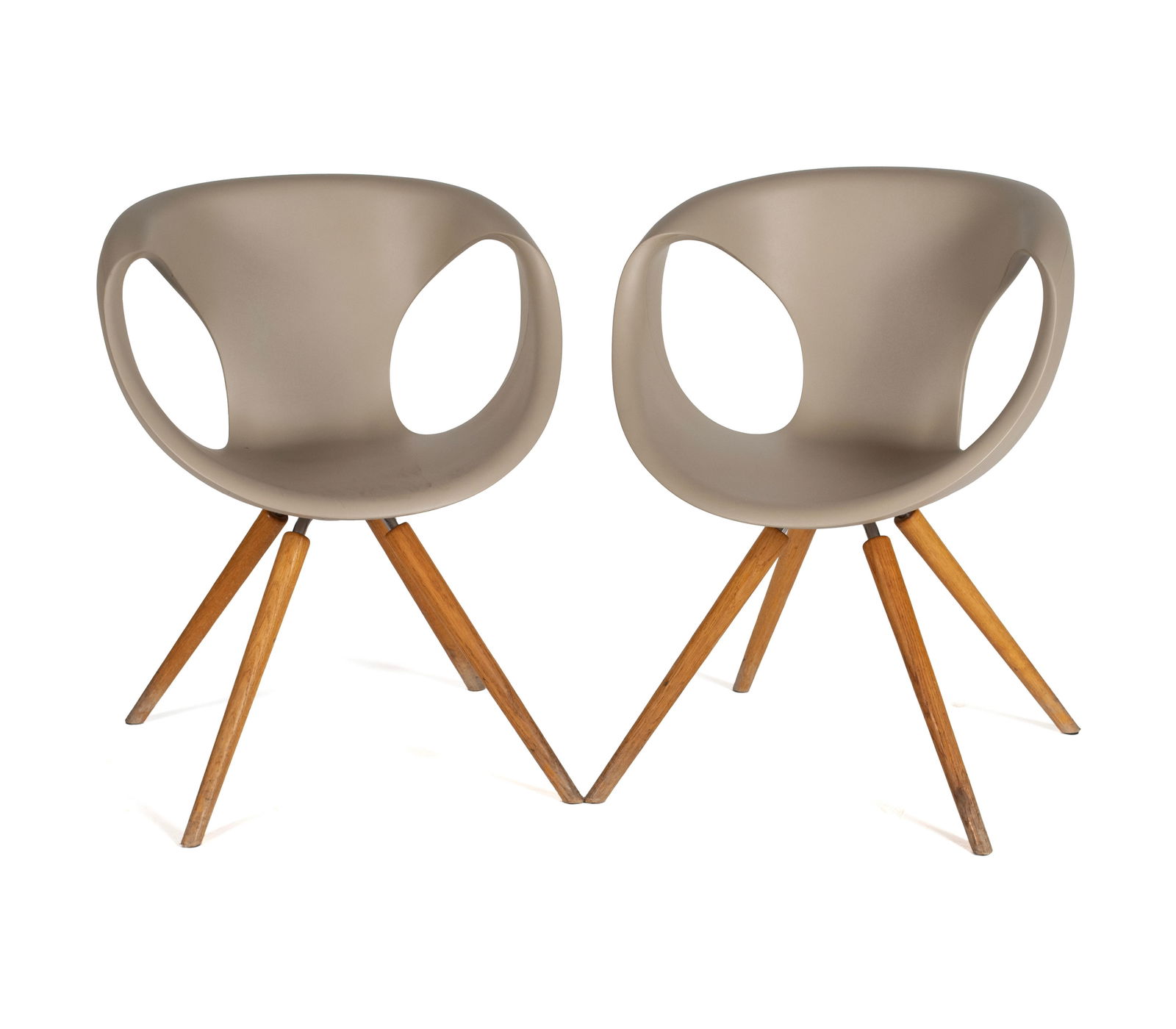 TWO 'UP' CHAIRS BY TONON: TWO 'UP' CHAIRS BY TONON Italian, designed by Martin Ballendat. Two (2) chairs with tan polyurethane shells on wooden legs, marked under seat. Each: 32 1/4 x 24 in. (81.9 x 61 cm.) Collection of