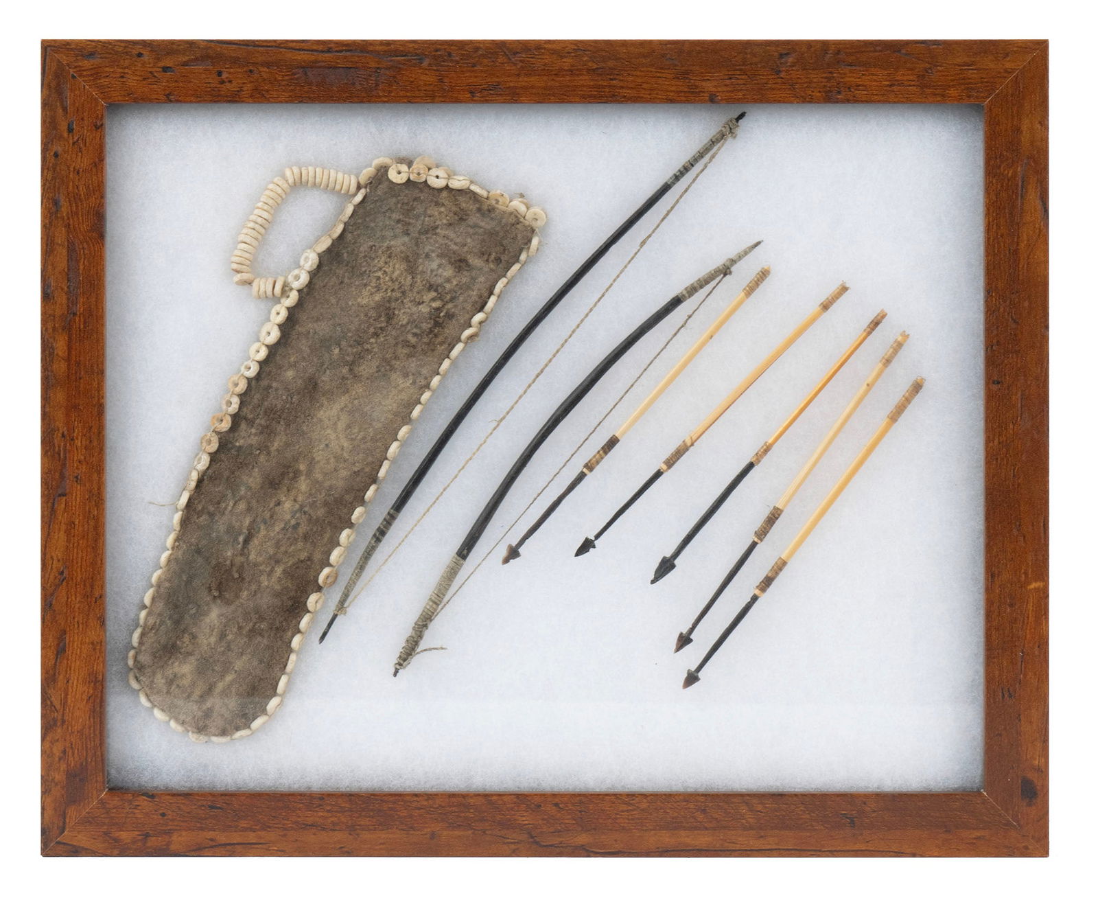 PLAINS NATIVE AMERICAN MINIATURE BOW & ARROW SET WITH QUIVER: PLAINS NATIVE AMERICAN MINIATURE BOW & ARROW SET WITH QUIVERLate 19th/early 20th century, probably Sioux or Chiricahua Apache. Two bows, five iron headed arrows and a bone disk decorated quiver.Larges