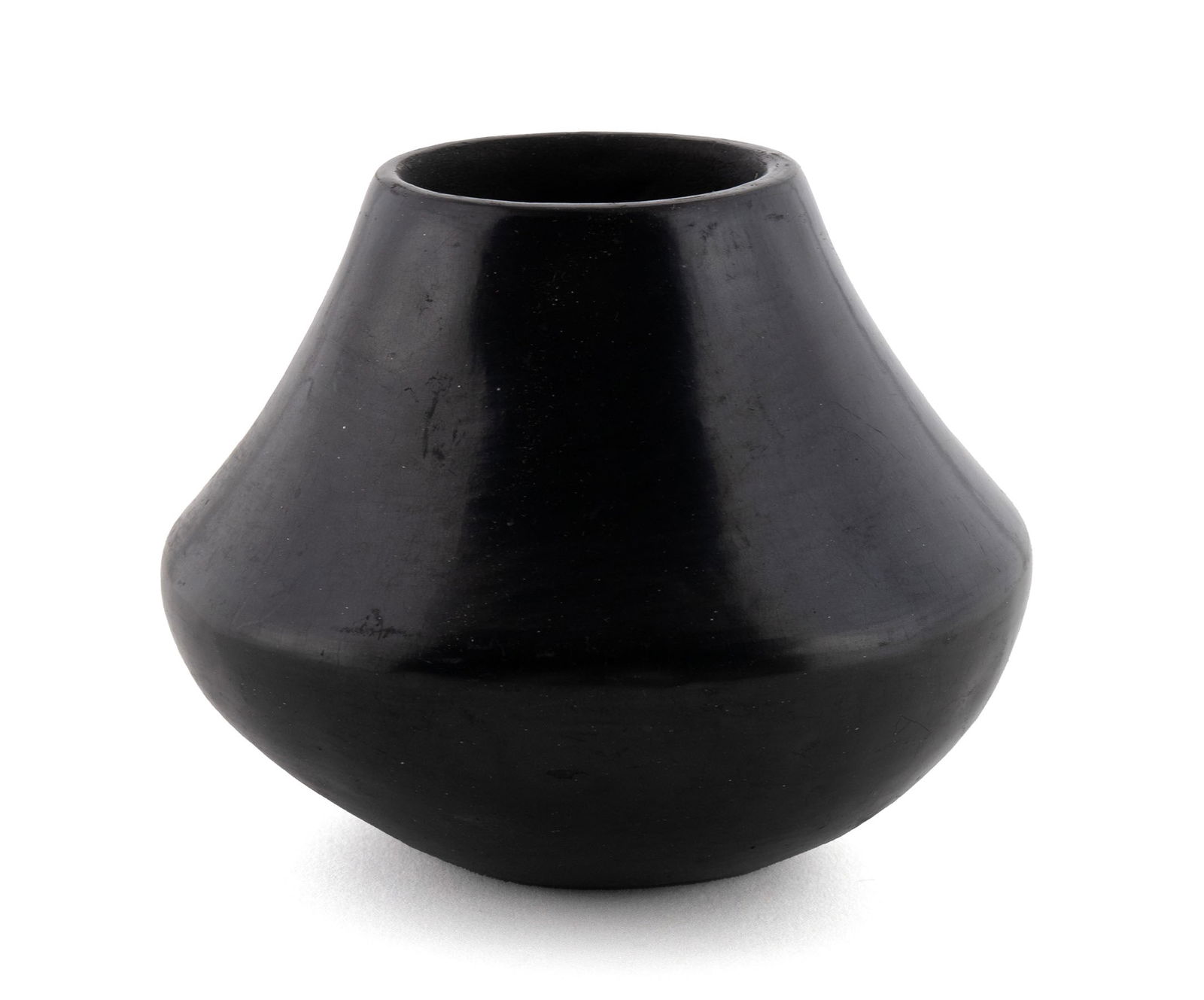 SOUTHWEST PUEBLO BLACKWARE POTTERY VASE SIGNED MARIA: SOUTHWEST PUEBLO BLACKWARE POTTERY VASE SIGNED MARIANative American, 20th century. Plain black finish, signed on bottom.4 x 5 1/2 in. (10.2 x 14 cm.)