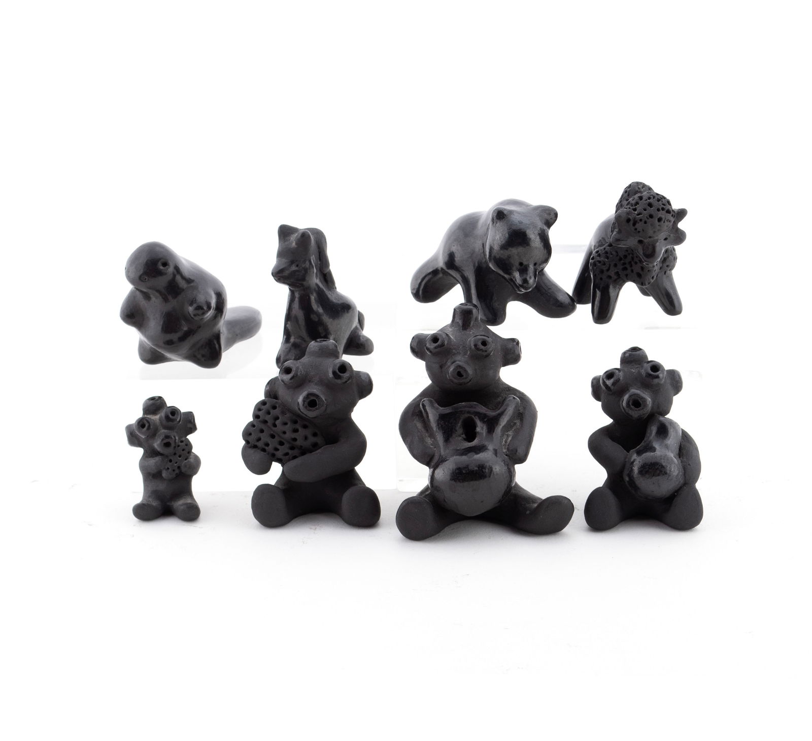 EIGHT SANTA CLARA BLACKWARE FIGURINES BY DOROTHY AND PAUL GUTIERREZ: EIGHT SANTA CLARA BLACKWARE FIGURINES BY DOROTHY AND PAUL GUTIERREZNew Mexico 20th century. Four (4) mud head figures together with four (4) animal figurines, all marked underfoot for Dorothy or for D