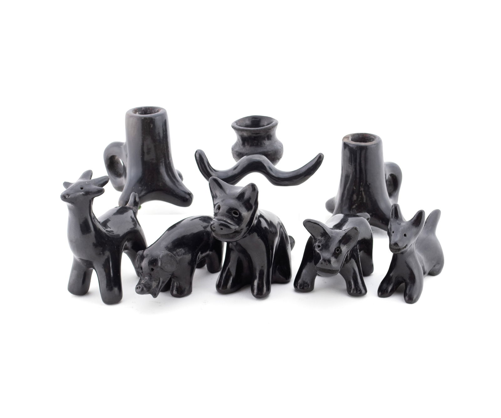 NINE PIECES OF PUEBLO BLACKWARE: NINE PIECES OF PUEBLO BLACKWARE Mexico, 20th century. Six (6) Mata Ortiz animal figurines, a pair of candlesticks, and a diminutive jar. Tallest height: 4 1/4 in. (10.8 cm.)