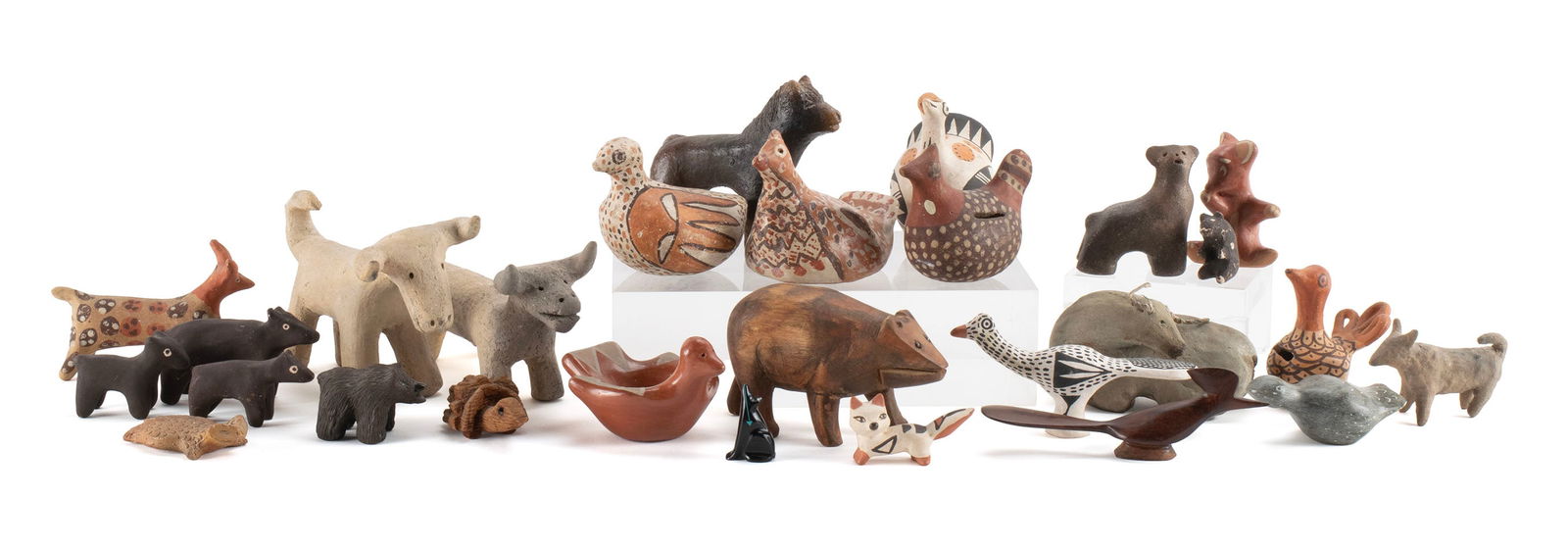 TWENTY-SEVEN NATIVE AMERICAN ANIMAL FIGURES: TWENTY-SEVEN NATIVE AMERICAN ANIMAL FIGURESNorth and South American. Collection consisting of three (3) wood figures, two (2) composition figures, one (1) stone figure and twenty-one (21) pottery figu