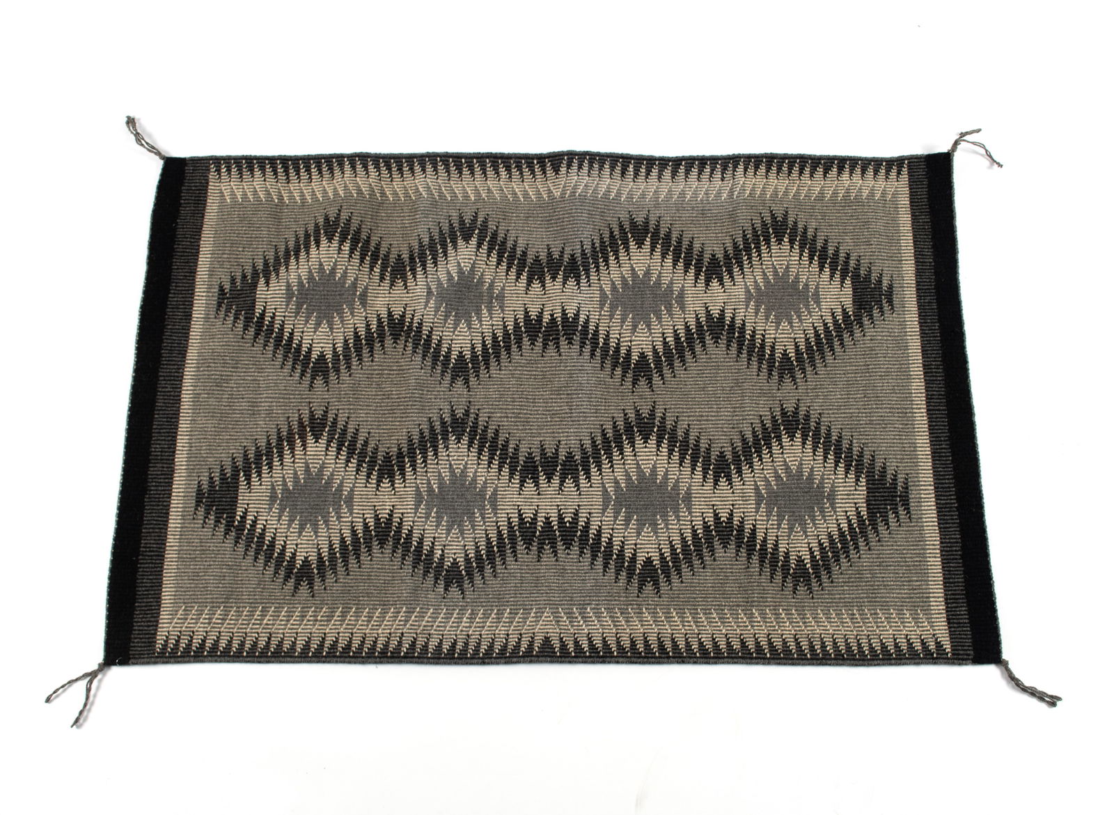 NAVAJO REGIONAL RUG: NAVAJO REGIONAL RUG Coal Mine Mesa, Arizona, 20th century. Wool rug with raised outline. 31 x 49 1/2 in. (78.7 x 125.7 cm.)