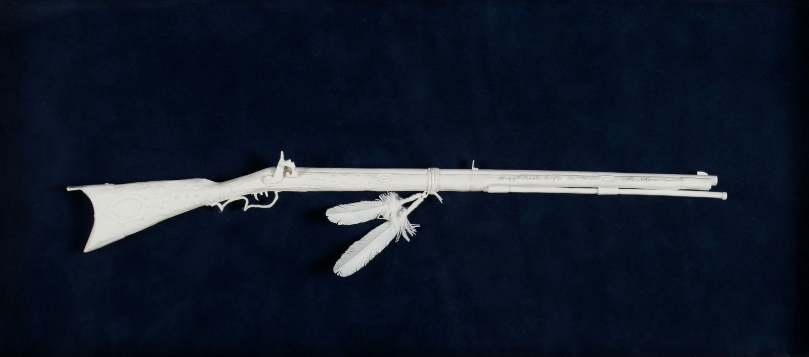 LIMITED EDITION "MUZZLE LOADER RIFLE" MODEL BY ALLEN ECKMAN: LIMITED EDITION "MUZZLE LOADER RIFLE" MODEL BY ALLEN ECKMANSigned, titled and numbered 30/100 across the barrel. Displayed in a shadow box.Rifle: 3 x 15 1/2 in. (7.6 x 39.4 cm.), Frame: 11 x 24 in. (2