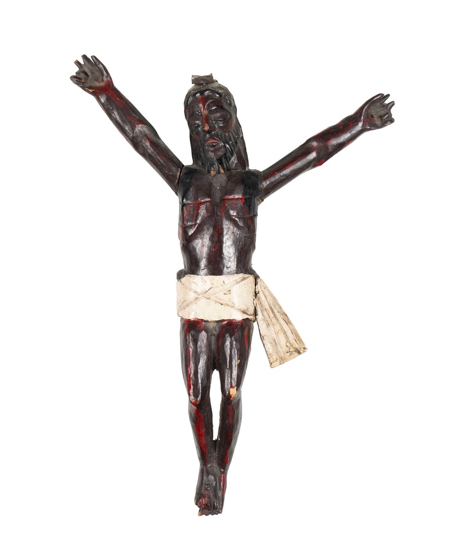 SPANISH COLONIAL CORPUS CHRISTI FIGURE: SPANISH COLONIAL CORPUS CHRISTI FIGUREMexican, 19th century. Polychrome decorated carved wood "black Christ" corpus, originally mounted to cross as a crucifix.9 x 6 1/2 in. (22.9 x 16.5 cm.)