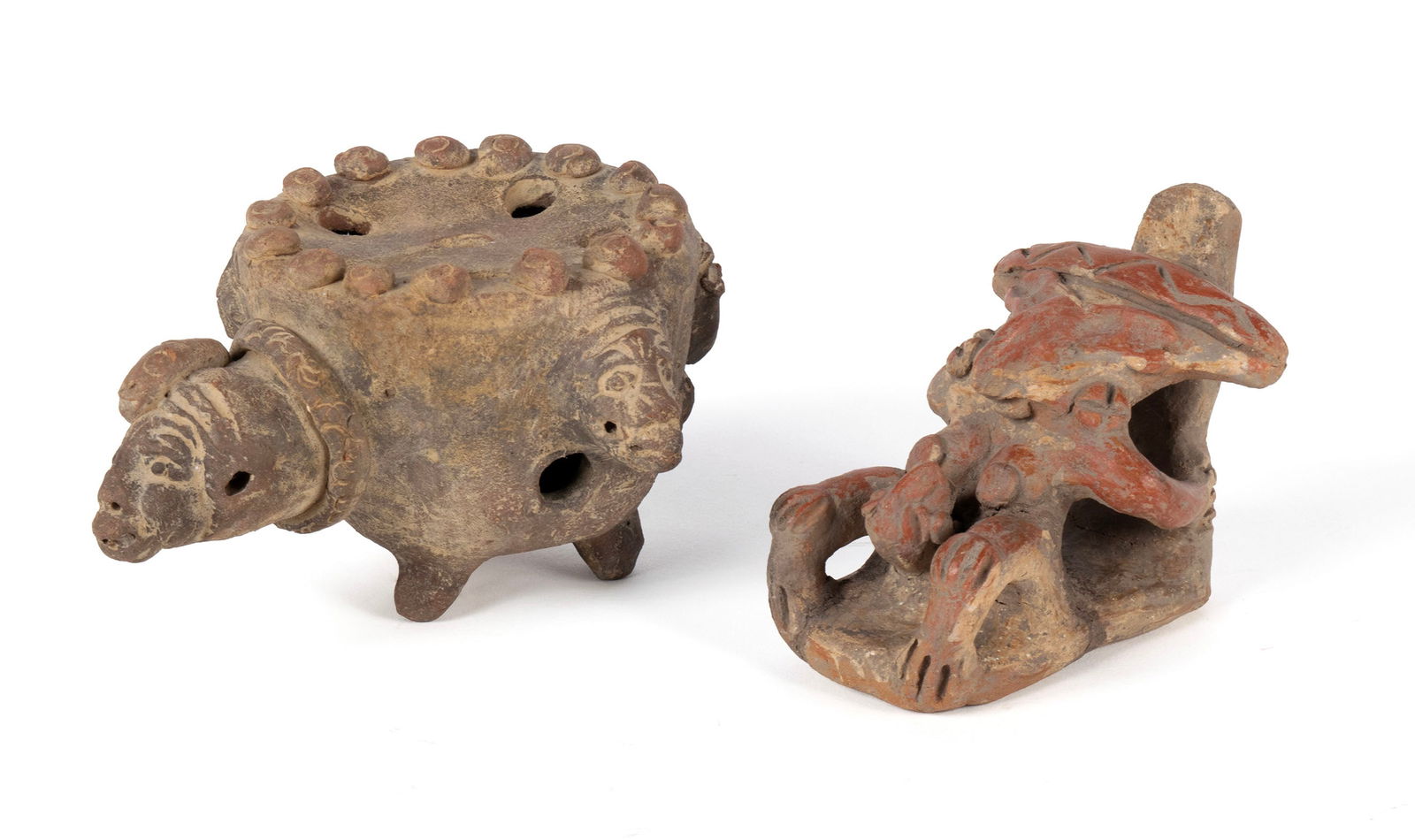 TWO PRE-COLUMBIAN MAYAN FIGURES: TWO PRE-COLUMBIAN MAYAN FIGURES Antiquities, earthenware. Both of figural form, one with six holes on top over formed figural elements all around on tripod feet. The other a seated figure. Larger: 4