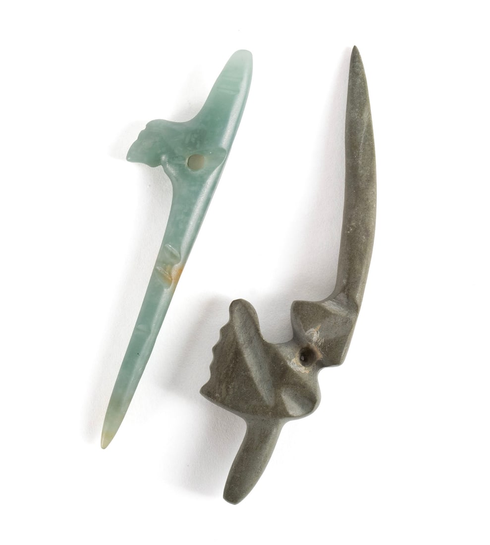 TWO HUMMINGBIRD PERFORATOR BLOODLETTERS: TWO HUMMINGBIRD PERFORATOR BLOODLETTERSJade. Both with slightly channeled beaks for bloodletting, one slightly curved with the other straight, with pierced eyelet holes to each.Longer: 3 in. (7.6 cm.)