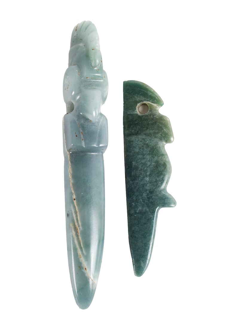 TWO PERFORATOR BLOODLETTERS: TWO PERFORATOR BLOODLETTERSJade. Carved bird-form highlights with pierced eyelet holes to each.Longer: 3.89 in. (9.9 cm.)