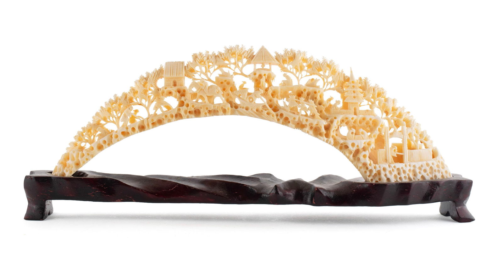 CHINESE CARVED BRIDGE: CHINESE CARVED BRIDGE 20th Century. Carved village scene on fitted wood stand. 3 x 1 1/2 x 9 in. (7.6 x 3.8 x 22.9 cm.)