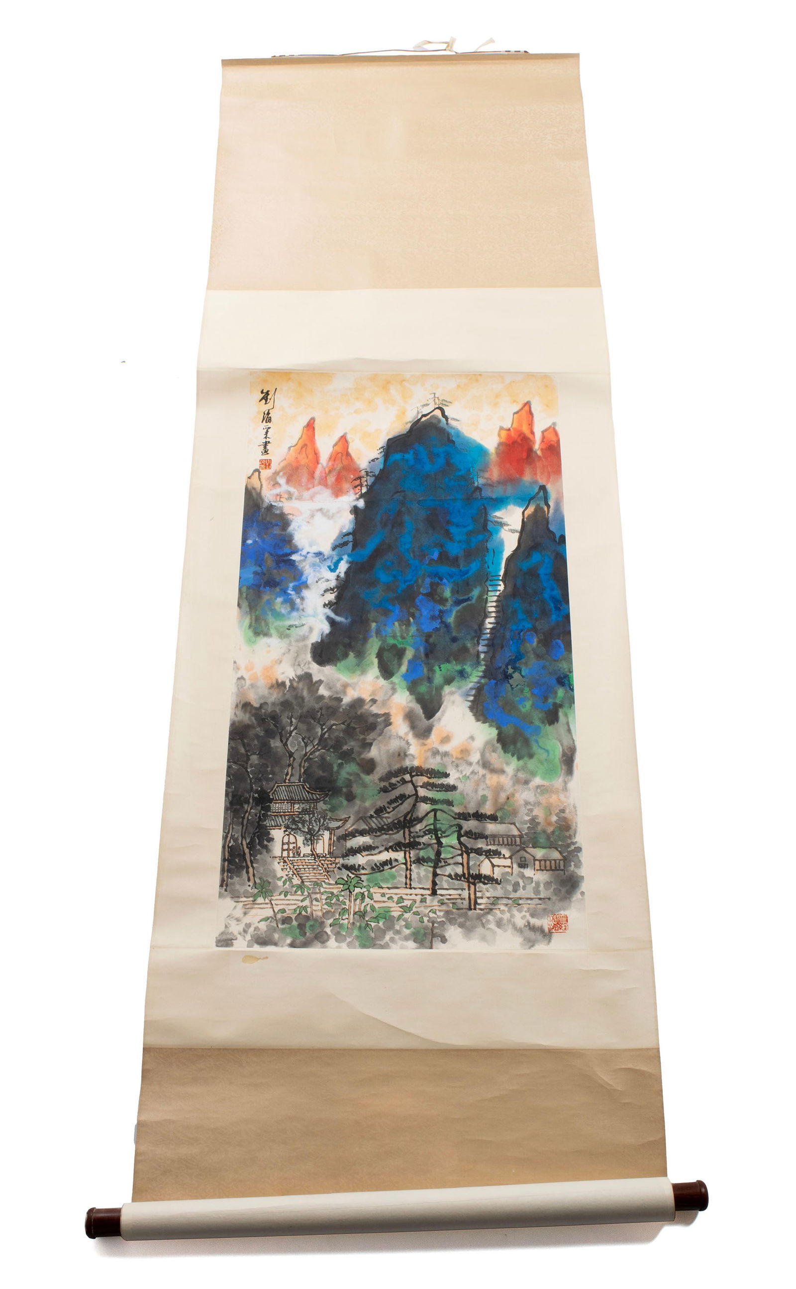 CHINESE SCROLL PAINTING: CHINESE SCROLL PAINTINGChinese, 20th century. Ink wash on paper landscape showing colorful mountains over village, with artist's seal and inscription.37 x 19 1/2 in. (94 x 49.5 cm.)