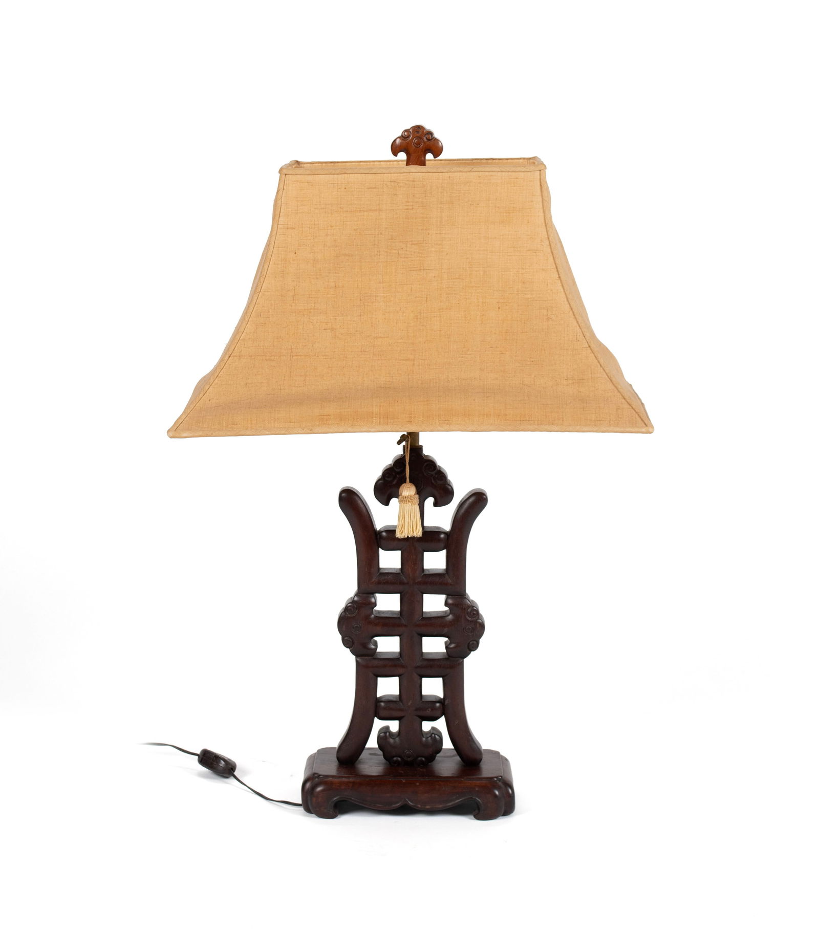 CHINESE PADOUK TABLE LAMP: CHINESE PADOUK TABLE LAMP20th century. Carved Padouk "Shou" longevity symbol standard with linen shade.Height overall: 32 in. (81.3 cm.)